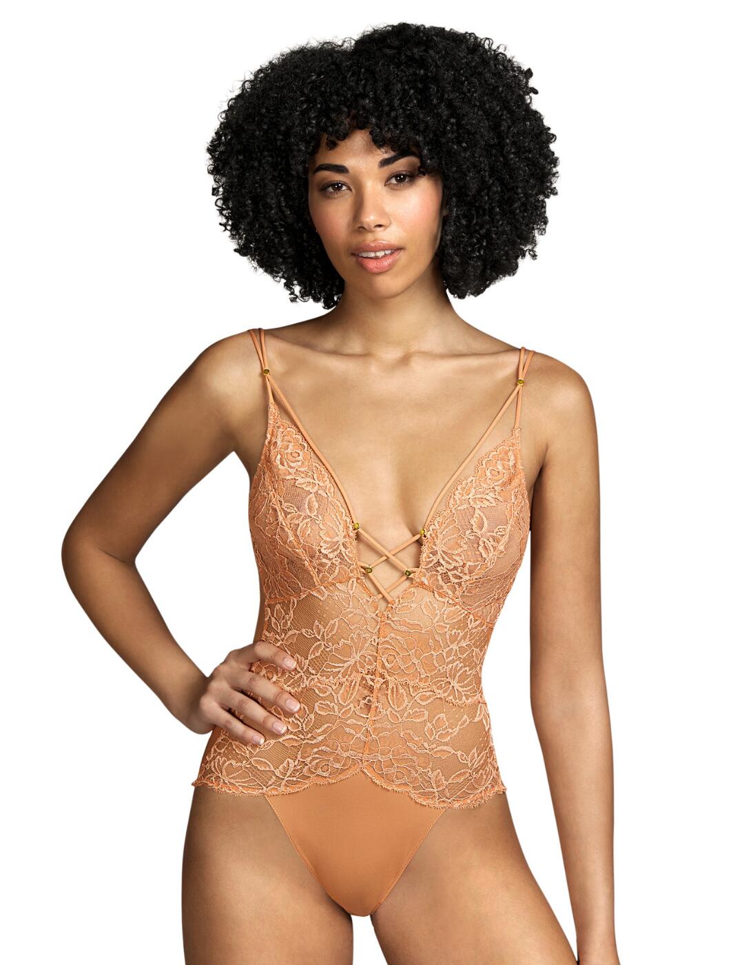 Spice up an outfit with this body from the Nadia range by Andres Sarda. Be sure to catch everyone's eyes when wearing this with a sexy semi-sheer all over lace look with criss cross strappy centre detailing that frames your bust and showcases your cleavage. This body ensures a comfortable fit with soft microfibre, double adjustable straps and a wire-free design. It has a plain opaque back that covers the crotch and rear which provides medium rear coverage.  Body All over sexy semi-sheer lace Criss cross strappy centre with gold charms Comfortable fit Wire-free design Made from soft microfibre Double adjustable straps Medium rear coverage Country of origin: Tunisia Composition: 87% Polyamide &pipe; 9% Elastane &pipe; 4% Cotton  Listed in UK sizes  55824-99323-1286459 3311340  Body