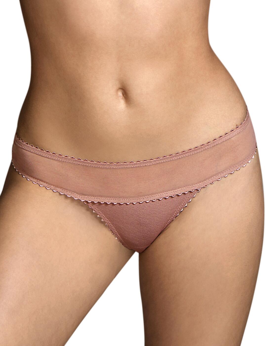 Add some luxury to your lingerie collection with the Switzer range by Andres Sarda. This short thong is an elegant piece of lingerie with a tulle waistband and scallop edges and ensures a comfortable fit with a microfibre crotch. It has a low-rise waist and a thong rear with minimal coverage. Matching items are available to create a fully sexy look.  Short thong Tulle waistband Scallop edges Microfibre crotch Low-rise waist and minimal rear coverage Matching items available Country of origin: Tunisia Composition: 64% Polyamide &pipe; 21% Elastane &pipe; 15% Cotton Listed in UK sizes  55844-99352-1287812 3311155  Thong