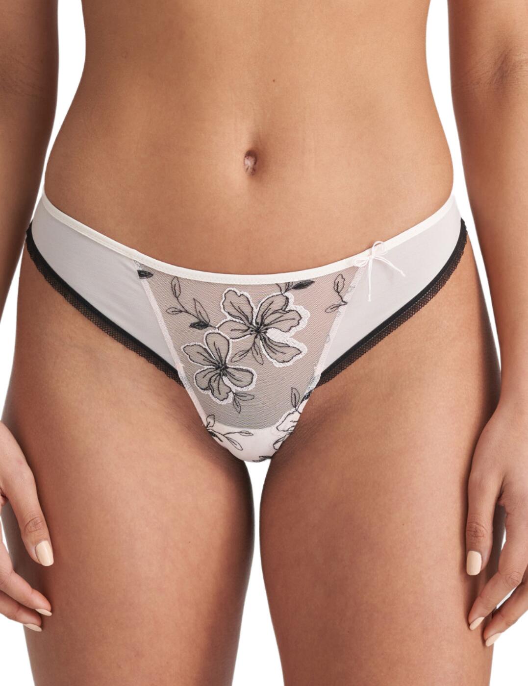 Feel your most beautiful self in this delicate thong by Maire Jo. The Noorah collection blends abstract prints with feminine style to create irresistible pieces. This thong features a gorgeous abstract floral print on sheer tulle fabric giving this piece a soft and flirty feel. Cut to a low-rise waist with the classic thong minimal rear coverage, this piece is perfect for those wanting something on the more seductive side. Boasts a cute bow detail on the front panel for a dainty feminine touch. Features a contrasting lower trim for a splash of edge to this airy fit. A beautiful piece that would look great in your lingerie drawer!  Soft and sensual Low-rise waist Minimal rear coverage Abstract oversized floral print Sheer tulle Contrasting trim Cute bow detail on waistband Country of origin: Tunisia Composition: 45% Polyamide &pipe; 24% Polyester &pipe; 19% Elastane &pipe; 12% Cotton  Listed in UK sizes  55872-99400-1288420 0602620 Thong