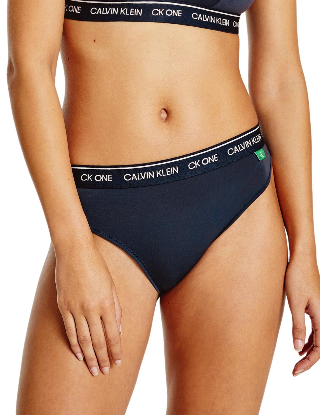 The CK One Recycled collection combines sports-luxe style with premium recycled fabrics. These high leg tanga briefs boast the iconic Calvin Klein logo waistband in a subtle chic style. The flattering mid-rise waist and high leg cut elongates the legs. Matching lingerie is available from the CK One Recycled range by Calvin Klein for a sexy sporty look.  Eco-friendly fabric Iconic Calvin Klein waistband Cheeky rear coverage Mid-rise waist Country of origin: Sri Lanka Composition: 89% Recycled Polyester &pipe; 11% Recycled Elastane Listed in UK sizes  51915-93556 000QF6504E High Leg Tanga Brief
