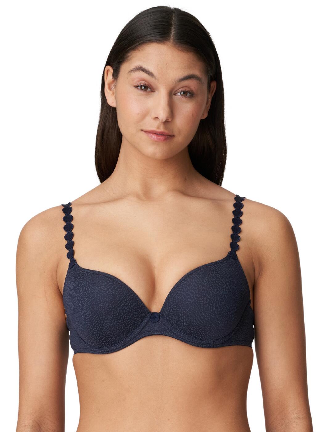 This feminine push-up bra is from the Tom range by Marie Jo and will become the most-loved item in your collection! The bra hosts a luxurious design with opaque fabrics throughout with a subtle sheen and flirty circle cut-outs across the straps and in the centre. It also brings a fit you're sure to fall in love with as the push-up cups showcase your bust beautifully, an underwire that creates unbeatable support and it also allows for an individual fit with adjustable straps and a hook and eye closure.  Push up bra Luxurious design Opaque design with a subtle sheen Circle cut-out across straps and in the centre Push up style showcases your bust Supportive fit from underwire Adjustable straps and a hook and eye closure Country of origin: China/Nanhai Composition: 86% Polyester &pipe; 8% Polyamide &pipe; 6% Elastane Listed in UK sizes  56070-99622-1291327 0220827  Push Up Bra