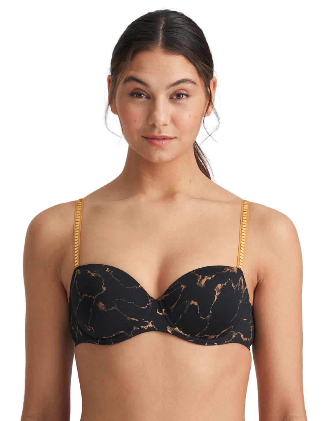 The Colin range by Marie Jo is a new must-have to provide that luxurious feeling. This padded balcony bra has incredibly flattering cups with the balcony shape and padded feature. It has a built-in underwire which ensures excellent support and allows for the perfect fit with adjustable straps and a hook and eye closure. The bra is covered in an opaque fabric with a marble print and gold running throughout, matching the straps.  Padded bra Balcony shaped cups Underwire for support Adjustable straps and a hook and eye closure Covered in an opaque fabric with a marble print Country of origin: China/Nanhai Composition: 56% Polyester &pipe; 38% Polyamide &pipe; 6% Elastane Listed in UK sizes  56094-99646-1292941 0122289  Balcony Bra