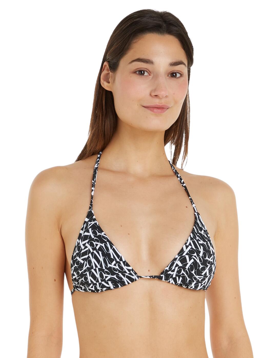 Feel fabulous this season with the stunning Calvin Klein triangle bikini top. This piece has non-padded lined cups and is wireless for amazing daily comfort at the beach or by the pool. Featuring tie-up fastening for a perfect-fit bikini top, altered to your desired fit. This comfortable design has the iconic CK logo printed uniquely for a quirky finish. To complete this swimwear set, snap up the matching available coordinates now!  Triangle bikini top CK warped monogram pattern Non-padded Wireless Tie fastening Comfortable fit Matching coordinates available Country of origin: Vietnam Composition: 83% Recycled Nylon &pipe; 17% Elastane Listed in UK sizes  59725-104485-1388844 KW0KW02079 Halter Bikini Top
