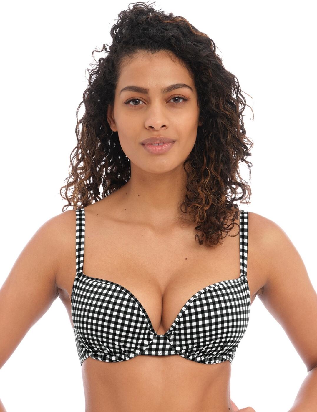The 60s have returned with Freya's Check In range. Feel beach ready in this stunning gingham print bikini top. Featuring a teasing plunging neckline and underwired, non-padded cups which all work together to give you a supportive and comfortable yet flattering look to your chest. Adjust the shoulder straps to your preferred fit and close with the secure back clasp. Complete this retro set by pairing it with one of the matching Check In briefs.  Moulded bikini top Plunging neckline Gingham print Underwired Non-padded Adjustable shoulder straps Classic back clasp closure Matching coordinates available Country of origin: Tunisia Composition: 82% Polyamide &pipe; 18% Elastane Listed in UK size  59845-104623-1370249 201908 Plunge Bikini Top