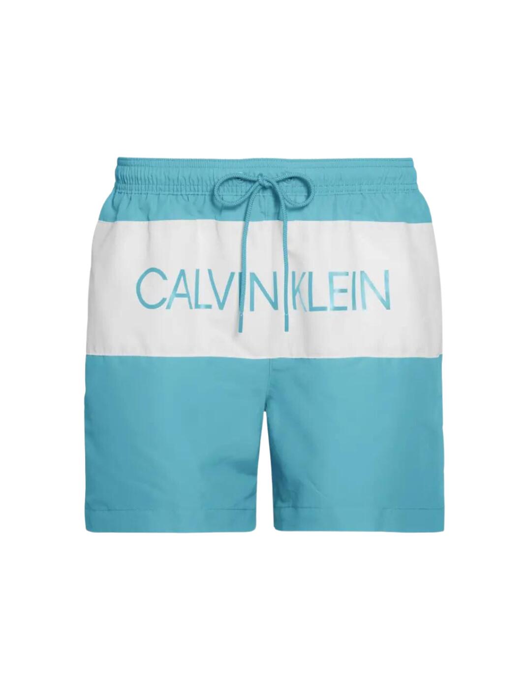 The Core Logo collection combines the iconic Calvin Klein logo with sustainable swimwear designs. These men's drawstring trunks flaunt a contrasting Calvin Klein logo on front for statement designer look. A classic regular fit with a mid-rise waist and medium length allow for the utmost all-day comfort. Made from a premium quality recycled polyester with an adjustable drawstring for the perfect fit.  Bold Calvin Klein logo Mid-rise waist Medium length Adjustable drawstring Comfortable regular fit Composition: 100% Recycled Polyester Listed in UK sizes  50153-90817-1200558 KM0KM00456 Men's Swim Trunks