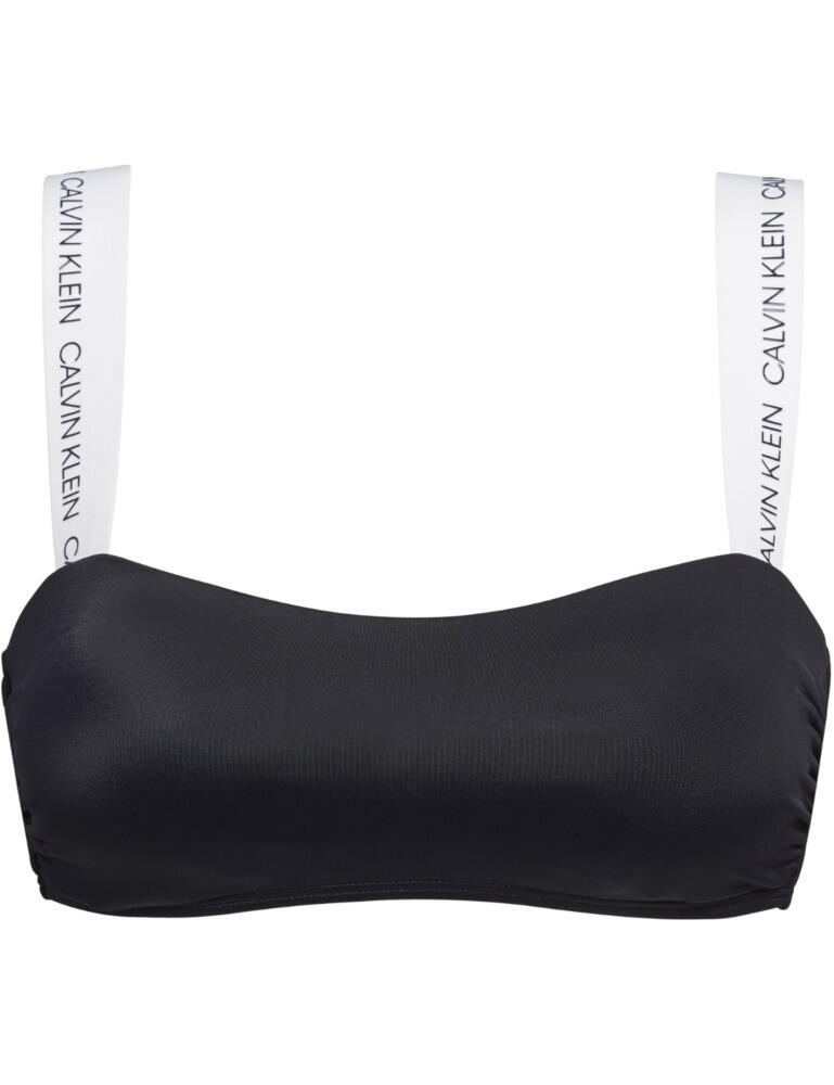 Stand out from the crowd in this gorgeous bandeau bikini top from Calvin Klein's CK Logo range. Featuring removable padded cups for a naturally rounded shape. This bikini top is non-wired for extra comfort. Elasticated straps ensure a perfect fit with the signature Calvin Klein logo. The clasp closure at that back ensures all day support. Pair with matching items to complete the look.  Padded Removable pads Non-wired Elasticated straps Signature logo Clasp closure Composition: 82% Polyamide &pipe; 18% Elastane Listed in UK sizes  50177-90777 KW0KW00548 Bandeau Bikini Top