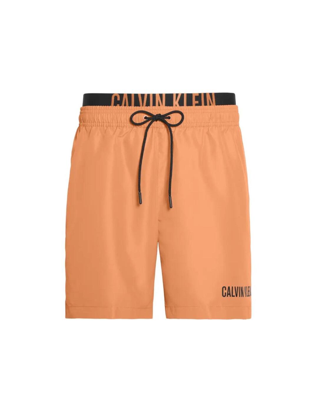 The Intense Power collection offers timeless classic swimwear designs with added bold Calvin Klein's logos. These men's swim trunks have a practical drawstring design for a individual fit and a double waistband that flaunts the signature Calvin Klein logo for a sporty designer style. The medium length and mid-waist allow for the utmost comfort and the mesh lining with pocket detail is practical for all day wear.  Sporty designer style Calvin Klein branded double waistband Practical pocket detail Medium length and mid-rise waist Comfortable mesh lining Adjustable drawstring design Composition: 100% Polyester Listed in UK sizes  50179-90780-1200485 KM0KM00450 Men's Swim Trunks
