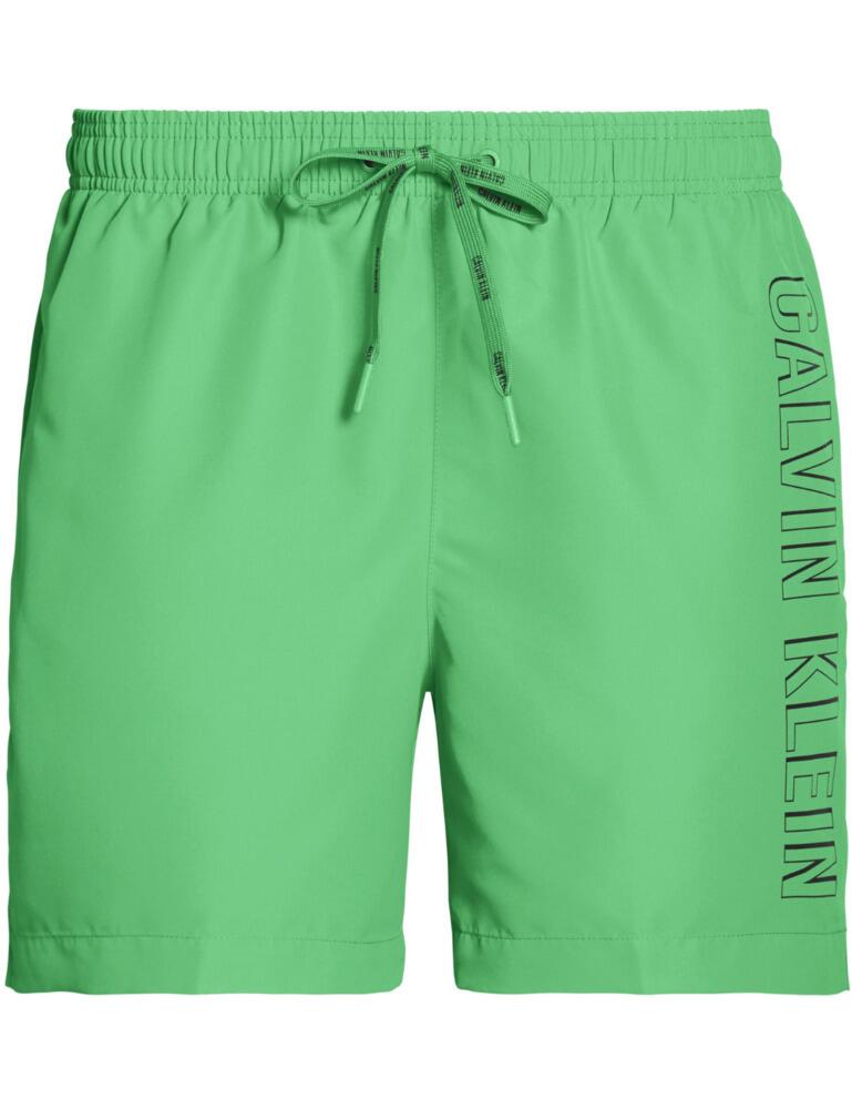 Look amazing in these drawstring trunks from Calvin Klein. Featuring the logo along the seams of the left leg for a stylish look. The medium length ensures full coverage with a mesh lining for security. Branded drawstring combined with the signature elasticated waistband ensures a secure and unique fit, the perfect item for lounging around the pool or on the beach.  Logo on the left seam Full coverage Mesh lining Medium length Branded drawstrings Signature elasticated waist Composition: 100% Polyester Listed in UK sizes  50219-90841 KM0KM00291 Men's Swim Trunks