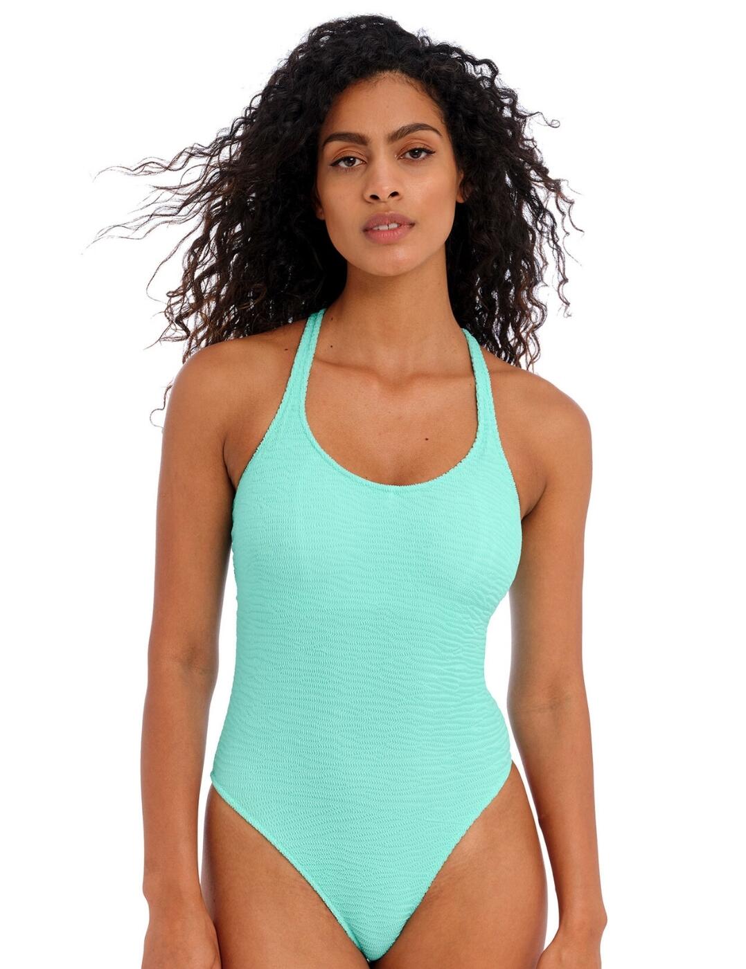 Get ready to take on the waves with the Freya Ibiza Waves swimsuit. This 80s-inspired swimsuit is sure to be a holiday favourite. Crafted with Italian crinkle fabric, it features a scooped neckline and wide adjustable shoulder straps for easy all-day wear. The hidden underwiring offers extra support if needed and the non-padded cups ensure utmost comfort whilst wearing. With a convertible back strap design that can be worn over the shoulder or crossed over, as well as a classic back clasp closure. Coupled with a keyhole cut-out at the back and a high-leg scoop finish, this bathing suit offers fashion-forward, minimal rear coverage for those looking for something trendy. Tap into fun nostalgia this holiday season with the Freya Ibiza Waves collection.