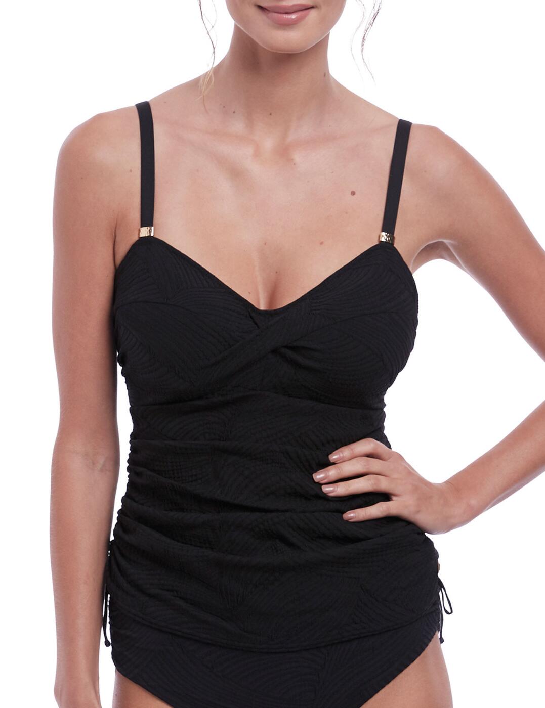 Make a splash this season with the Fantasie Ottawa tankini top. Perfect for poolside lounging or days at the beach, this stylish tankini top offers an on-trend design with metallic details. A flattering sweetheart neckline and a twist front create a modern silhouette while ruching through the body helps flatter your curves. Made with textured material, this tankini boasts concealed underwiring for additional support and comfort, as well as lightly padded foam cups to enhance your natural curves. Adjustable straps ensure a snug fit while the concealed hook and eye fastening ensure it will stay put throughout the day. Complete your look with one of our matching swimwear options from the Fantasie Ottawa collection.  Elegant classic design Metallic details Flattering sweetheart neckline Twist front and ruching body design Textured material Concealed underwiring for support Lightly padded foam cups for a rounded look Adjustable shoulder straps Concealed hook and eye fastening for a secure fit Matching swimwear available Country of origin: Tunisia Composition: 89% Polyamide &pipe; 11% Elastane Listed in UK sizes  59974-104763-1373497 6356 Padded Tankini Top