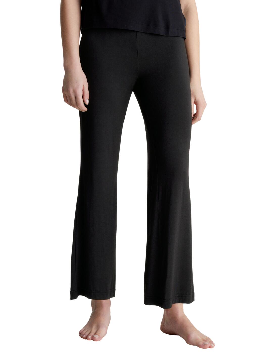 If you're looking for a combination of comfort and style in your everyday wear, then look no further than the Calvin Klein lounge pants. These sleek jersey lounge pants are crafted from a soft, lightweight fabric that feels great against your skin and is sure to keep you comfy all day long. The elasticated waist ensures that it fits perfectly to your body shape and the straight leg fit gives these pants a classic look. Plus, with the iconic Calvin Klein logo tag on the hip, you can wear and flaunt your designer pieces with pride. Upgrade your casual wardrobe with stylish Calvin Klein loungewear today!  Jersey lounge pants Soft lightweight fabric Elasticated waist Straight leg fit Calvin Klein logo tag on the hip Country of origin: Sri Lanka Composition: 96% Modal &pipe; 4% Elastane Listed in UK sizes  60109-104920-1378738 000QS6795E Pants