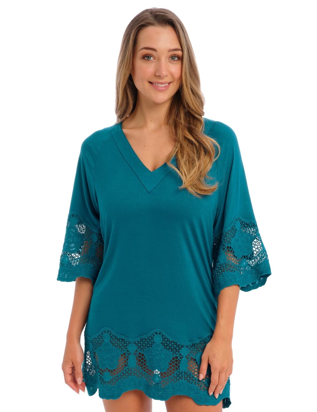 Ready to make a statement at your next beach getaway? Look no further than the Fantasie Dione tunic! This stylish and comfortable mini-dress is perfect for days spent lounging in the sand or by the pool. With a plunging v-style neckline, 3/4 sleeves and approximately mid-thigh length, the cover-up offers plenty of coverage, while still creating an alluring look. Embellished wide lace trims give it an air of elegance, so you'll be sure to turn heads wherever you go. The jersey material is smooth on your skin and offers extra breathability with maximum stretch. Don't wait—make a timeless summer style statement with this beautiful Fantasie Dione tunic!  Plunging v-style neckline Approx. mid-thigh length 3/4 sleeves Wide embroidered lace trims Comfortable stretch jersey material Country of origin: China Composition: 94% Viscose &pipe; 6% Elastane Listed in UK sizes  60130-104943-1376268 6364 Tunic