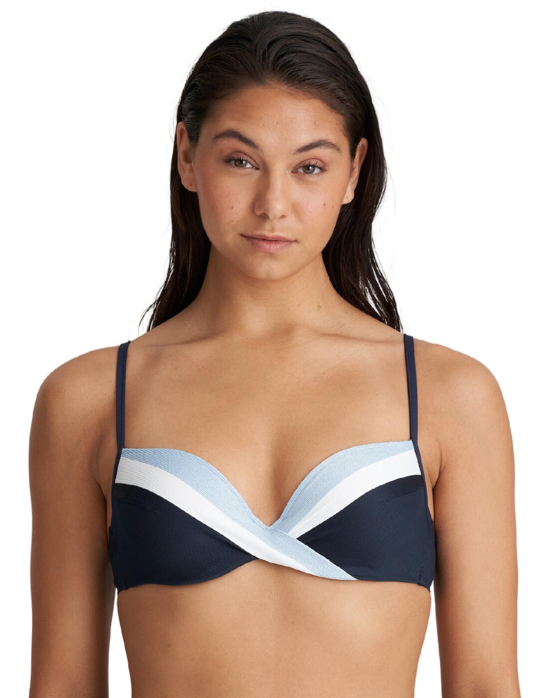 The Marie Jo Sitges padded plunge bikini top offers the perfect combination of style and support. This playful luxurious swimwear has a fresh and fun look that will have you standing out poolside in no time. It has great coverage cups with a flattering plunge neckline to ensure your bust looks amazing. The padding of the cups is designed to enhance your cleavage while a supportive underwire provides unparalleled support and stability. To give you the best possible fit, the bikini top features adjustable straps and a clasp fastening. An elegant look is completed with diagonal stripes, sophisticated pleats on the cups and subtle glitter for that extra feminine touch. To finish off your beach look, matching swimwear is available from this collection.