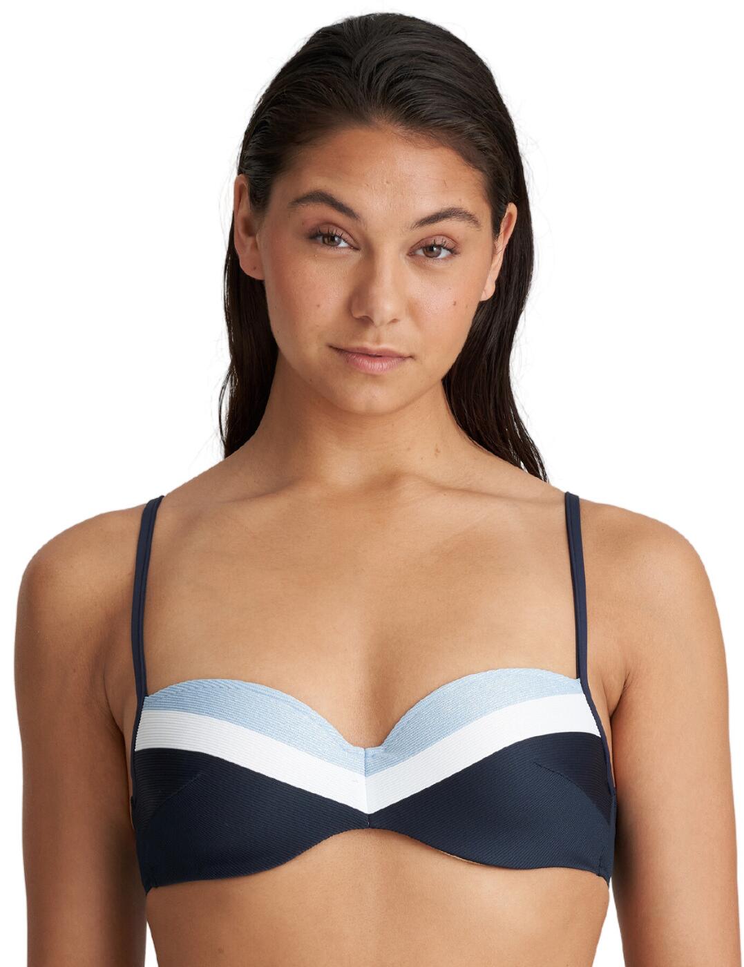 The Marie Jo Sitges padded balcony bikini top is the perfect addition to any stylish woman's collection of swimwear. With its playful stripe design across the upper cups, it offers a sophisticated and feminine look that flatters all figures. The neckline is shaped in a balconette style and features padded cups with supportive underwiring for maximum comfort and support. This top features multi-way adjustable straps and a clasp fastening to allow you to create an individual fit every time. For those who want more coverage, matching bottoms are also available so you can create your desired look.