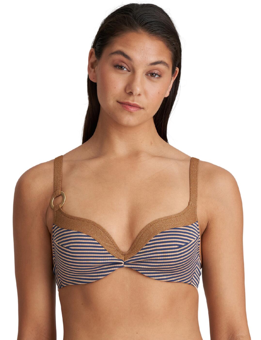 Stride in style with the Marie Jo Saturna heart-shaped bikini top! Featuring a timeless and modern design, this top is the perfect choice for making a fashionable statement at the beach or pool. Offering an exquisite silhouette, this bikini top boasts a flattering plunging neckline, as well as supportive underwire and padded cups. Delicate pleats on a striped cup add a hint of sophistication while a glittery gold outline and straps add an opulent finish. Multi-way adjustable straps and a clasp closure allow you to customize your fit for maximum comfort and ease of movement. Further punctuated by a charming asymmetric ring on the strap, complete your chic look with matching bikini bottoms available.  Heart-shaped bikini top Flattering plunging neckline Padded cups Supportive underwire Timeless pleated stripes across the cups Glittery gold outline and straps Multi-way adjustable straps and clasp closure Asymmetric ring on the strap Matching bikini bottoms are also available Country of origin: Tunisia Composition: 49% Polyester &pipe; 41% Polyamide &pipe; 9% Elastane &pipe; 1% Metal Fibre Listed in UK sizes  60191-105019-1378346 1005716 Padded Plunge Bikini Top
