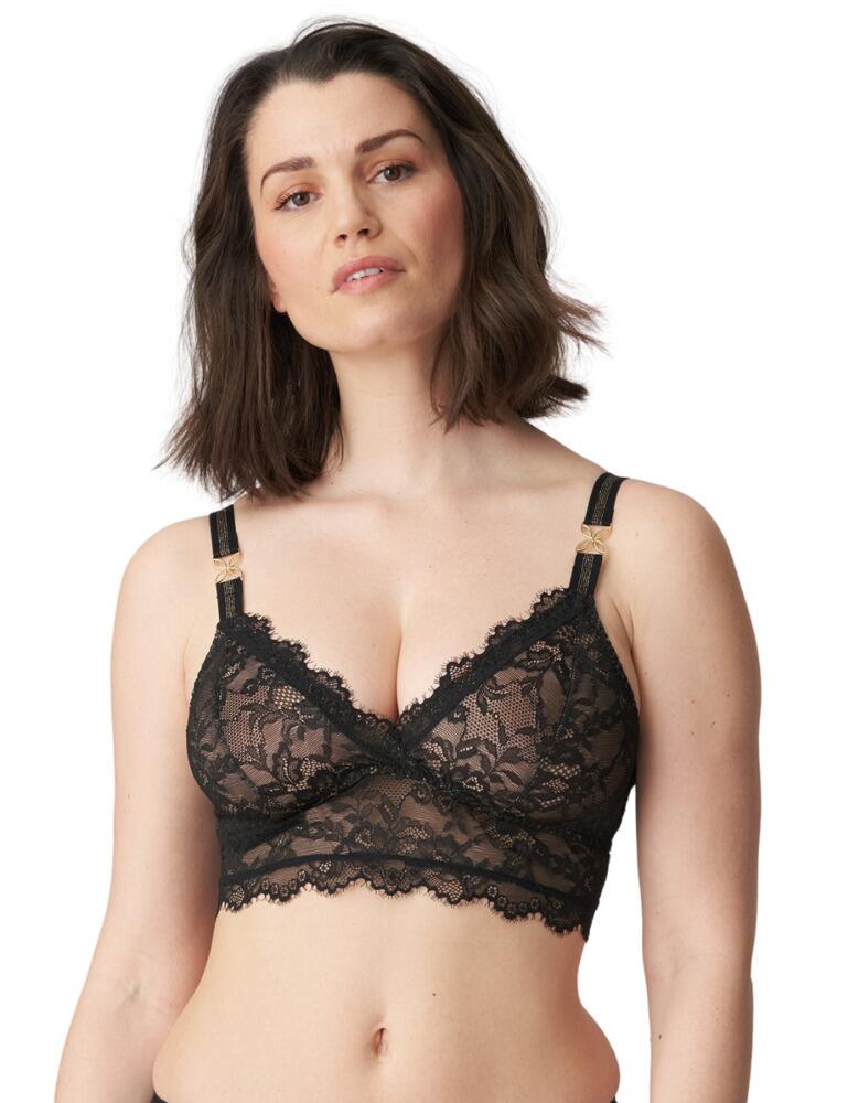 The stunning Prima Donna Arau wireless lace top is designed with semi-sheer lace to create a sexy and unique look. The sheer lace design throughout creates a bold statement for those who are looking for a bit of wow factor. The V neck structure of the cups, followed by thick adjustable straps, means there's excellent support for your bust. At the front, the straps are joined with an added jewel for that extra bit of glam! The back of the bralette is met with additional detailed touches; gold adjusters and a lace cut-out. The cut out at the back is to ensure the lace lies flat, for your comfort. There is a hook and eye fastening strap at the back, so the bralette can be put on with ease. This bralette is designed so that it can be worn two ways, the straps across the back can either be asymmetrical or crossing.  Wireless lace Adjustable straps Semi-sheer lace design Detailed jewels Can be worn with crossed back straps Composition: 58% Polyamide &pipe; 23% Polyester &pipe; 19% Elastane  Listed in UK sizes  50369-91201-1200124 0863290 Non-Wired Bra