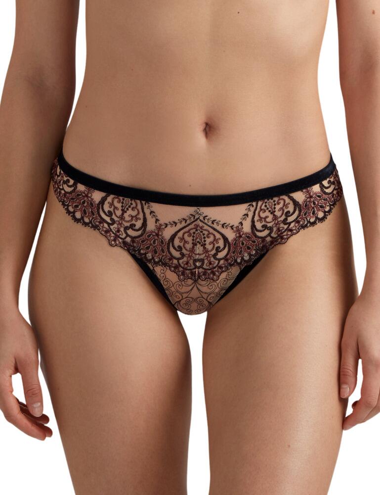 Inspired by Opera house costumes, the Coeurs Enlaces collection at Aubade will certainly make you feel centre stage! These delicate briefs will sit on your waist gracefully, with a low rise waist and high leg cuts. Transparent fabric and velvet trims are accompanied by delicate embroidery details for a truly elegant look. The rear features the cheeky thong cut for an all-eyes-on-me look. When matched with an accompanying bra, you'll ooze seductiveness.  Elegant thong brief mix Embroidery and velvet details Low rise waist Minimal rear coverage Composition: 54% Polyester &pipe; 32% Polyamide &pipe; 12% Elastane &pipe; 2% Lurex  Listed in UK sizes  50384-91226-1206393 QD26 Tanga Brief