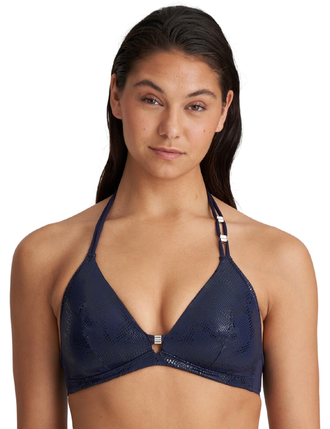 Introducing the Marie Jo San Domino padded triangle bikini top; perfect for women who seek an ultra-luxe look and feel while they lounge in the pool or beach. This swimwear is designed to flatter and enhance your bust like never before! It features triangle-shaped cups with a deep plunging neckline, along with lightly padded cups to further enhance your cleavage. Comfort is covered too, as the wireless design provides a comfortable fit all day long. The back clasp closure and double halterneck tie straps ensure this bikini top stays securely in place and provides a custom fit. The fabric of this high-end swimwear boasts an all-over eye-catching shimmery snakeskin effect, as well as elegant silver charms on one strap and in the centre for a luxurious touch.