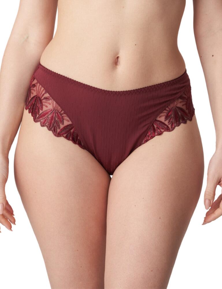 This Prima Donna thong from the Orlando range is a must-have lingerie piece to add to your collection. The thong has luxurious extra embroidery on the sides to create a flattering look on the leg and waist. The added lace embroidery follows round to the back of the thong. The waistline fit creates a flattering and elegant look.  Thong Embroidery detail Flattering waistline Minimal rear coverage Composition: 77% Polyamide &pipe; 9% Elastane &pipe; 6% Cotton Listed in UK sizes  50431-91295-1203225 0663151 Thong