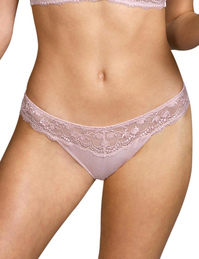 The Raven collection combines a simple yet flirty style with Andres Sarda's renowned premium lingerie designs. This short thong has a minimalist look with a timeless thong shape and added sexy floral lace that seductively shows a touch of skin. A scalloped trim adds a luxurious delicate finish whilst highlighting your curves. Wear with matching lingerie from the Raven range for an elegant sultry look.  Sexy minimal design Premium quality Delicate scalloped edges Flirty see-through lace detail Low-rise and minimal coverage Composition: 50% Polyamide &pipe; 28% Modal &pipe; 12% Elastane &pipe; 5% Cotton &pipe; 5% Silk Listed in UK sizes  50510-91602-1205011 3309855 Short Thong