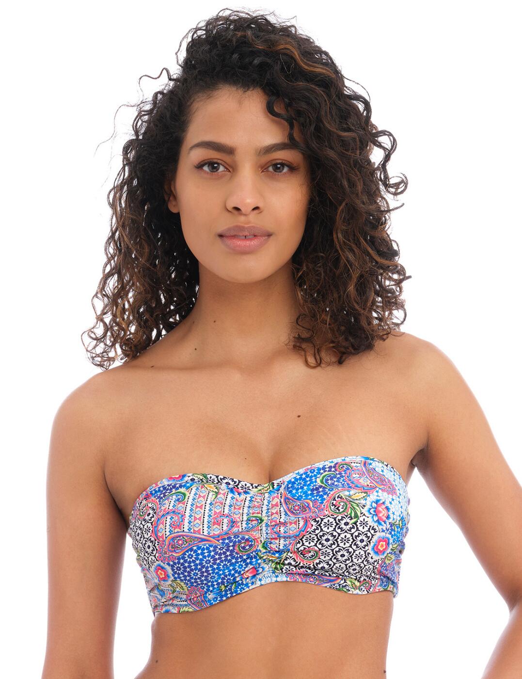 Create truly unique outfits this season using the Freya Boho Breeze bandeau bikini top. This beautiful bikini top is designed to be versatile and is featured in an eye-catching mosaic art pattern. It's underwired for great support and is non-padded with foam cups for shape while the gathering at the bust provides a beautiful, flattering fit and look. Plus, choose the neckline that suits you most with the removable centre front tie! With optional adjustable shoulder straps and the back clasp fastening you can tailor this stunning top any way you want! Plus the shell charm detail completes this look of beach glamour. Mix and match with some of the available coordinates in this collection.  Bandeau bikini top Mosaic art pattern Underwired for support Non-padded, foam cups for shape Gathering at the bust for flattering shape Detachable, adjustable shoulder straps Removable centre front tie for custom styling Shell charm detail Classic back clasp closure Matching coordinates available Country of origin: Indonesia Composition: 84% Polyamide &pipe; 16% Elastane Listed in UK sizes  60619-105517-1386313 202310 Balcony Bikini Top