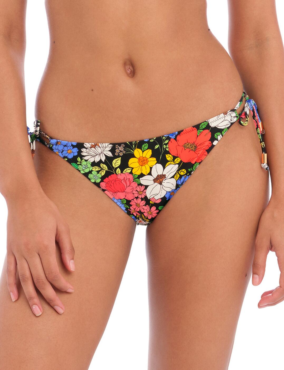 Embrace vibrancy and florals this season with the Freya Floral Haze tie-side bikini briefs. Featuring a beautiful retro flower pattern and gold trim detail on the ends of ties, these bikini briefs will make an unforgettable statement on your next holiday. With its low-rise waist and adjustable sides, you can easily customize it to your desired fit. Not to mention, moderate rear coverage allows your confidence to blossom in the water due to the all-day support. Plus, with matching coordinates available, you'll have a picture-perfect poolside look!  Tie-side bikini brief Retro flower pattern Low-rise waist Narrow, adjustable sides Gold trim detail on ends of ties Moderate rear coverage Matching coordinates available Country of origin: Tunisia Composition: 84% Polyamide &pipe; 16% Elastane Listed in UK sizes  60677-105600-1387505 202875 Bikini Bottoms
