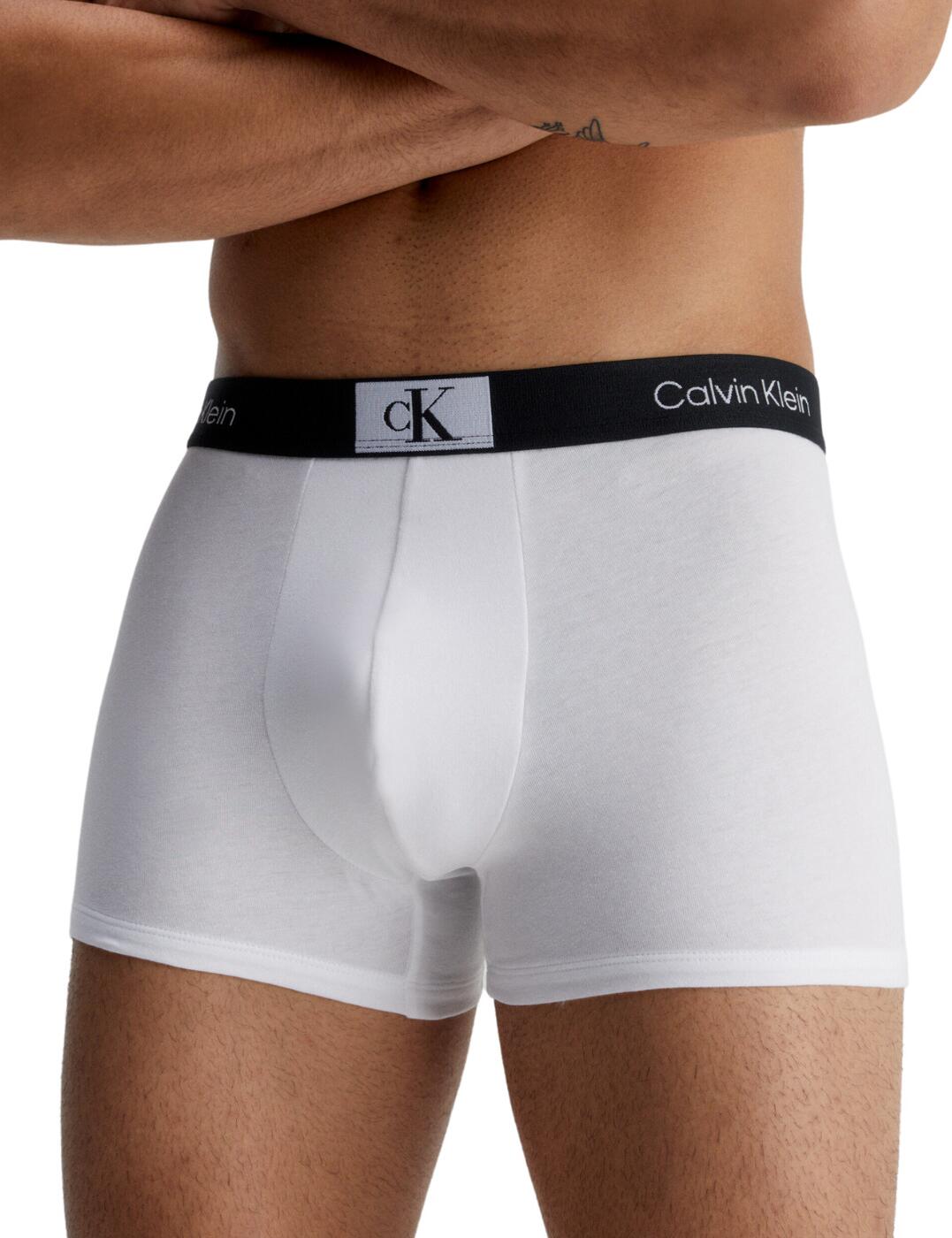 Calvin Klein Mens CK96 3 Pack trunks elevate your classic look to next-level style with this sleek multipack of trunks. Made with a cotton elastane blend, these trunks are designed to provide maximum comfort and mobility. Plus, they're made with recycled fibres for the eco-conscious consumer. Featuring a medium waist rise and the signature elasticated Calvin Klein waistband, these trunks are sure to make a statement. Both fashionable and functional, these trunks will keep you looking and feeling your best all day long. Whether you’re active or lounging at home, stay stylish in the CK96 pack of trunks from Calvin Klein – fashion that looks great and does good for the planet!  Mid-rise waist Classic trunk design Made from recycled fabrics Sleek and stylish 3 pack of trunks Country of origin: India Composition: 74% Cotton &pipe; 21% Recycled Cotton &pipe; 5% Elastane Listed in UK sizes  60599-105496-1403556 000NB3528A Men's Brief