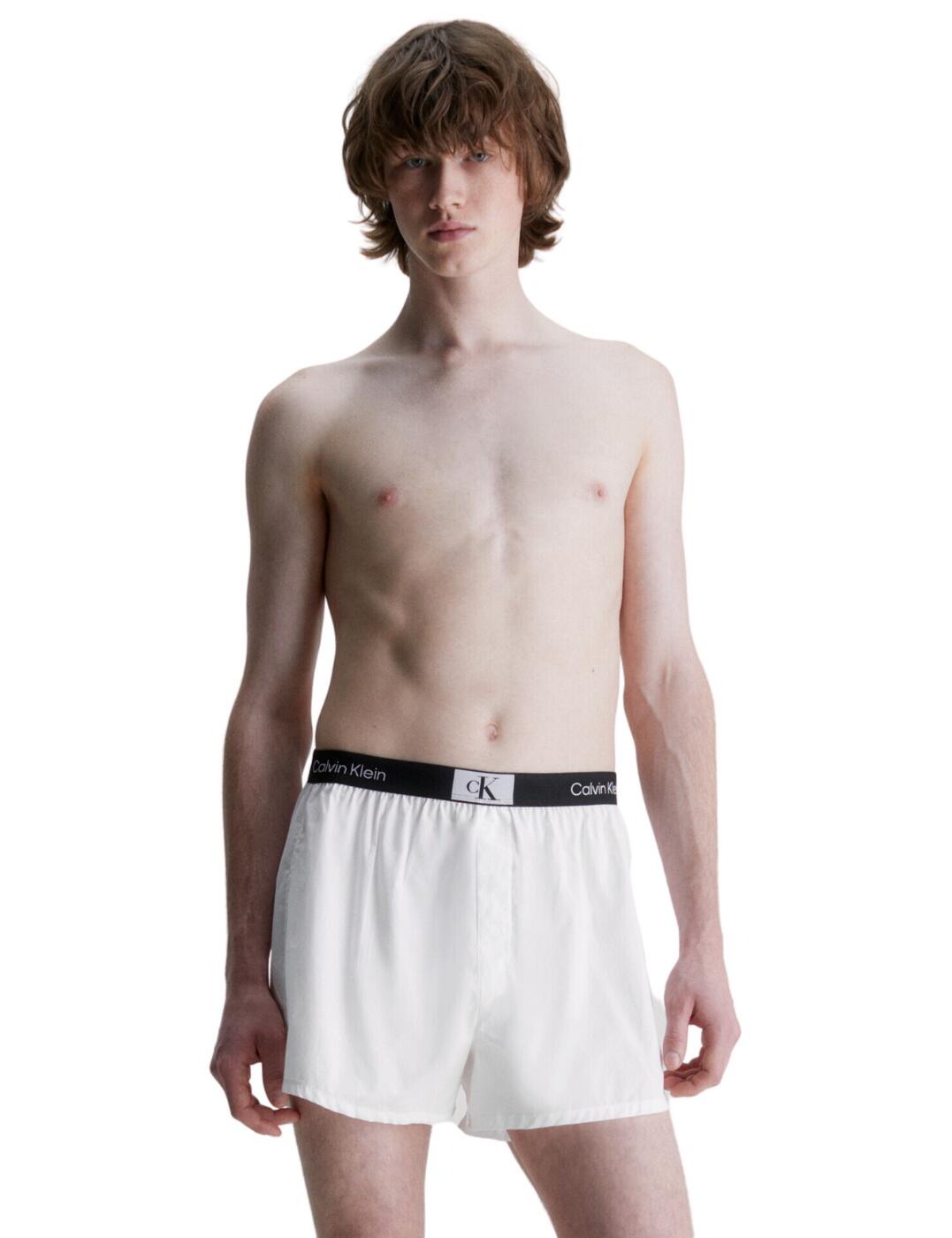 Calvin Klein Mens CK96 3 Pack Trunks – a style guaranteed to elevate any man’s underwear wardrobe. These trunks boast an iconic Calvin Klein monogram logo to create a fashionably bold look, as well as an elasticated waistband for added comfort and support. Made using pure cotton woven fabric, these lightweight stretch threads provide superior breathability, making them perfect for exercise. Designed with a slim fit and medium-rise waist your daily style just got easier with this new menswear staple. Be sure to pick up the Calvin Klein Mens CK96 3 Pack Trunks today and show off your modern look yet timeless style!  Practical 3-pack Mid-rise waist Button fly Elasticated waistband for comfort Slim fit Calvin Klein logo detailing Country of origin: India Composition: 100% Cotton Listed in UK sizes  60608-105506-1403631 000NB3412A Men's Brief