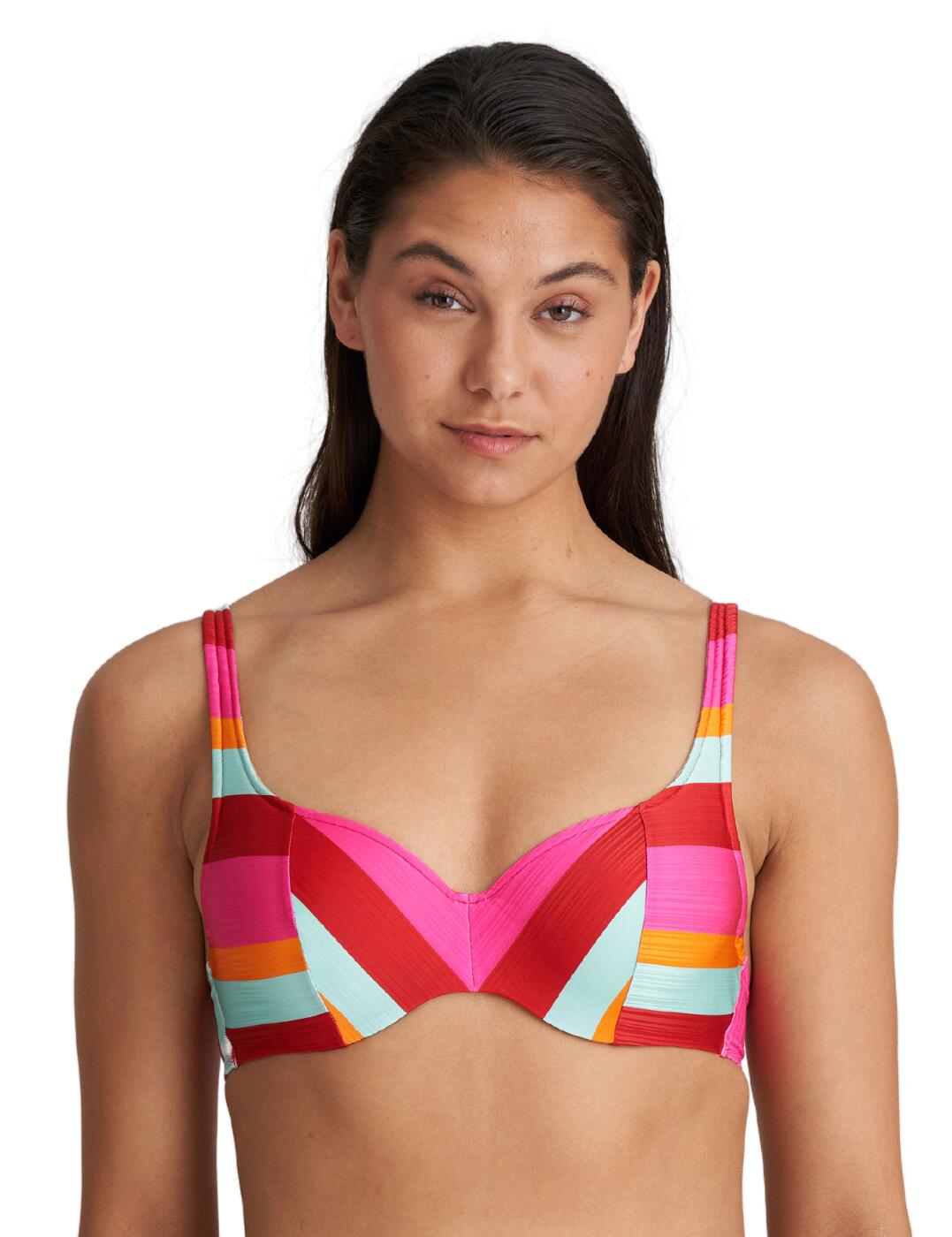 The striking Tenedos collection by Marie Jo offers the most luxurious beachwear choices. This bikini top features bright colours throughout, which will definitely turn some heads. The flattering balcony-style neckline highlights your curves, while still maintaining a comfortable design. The underwiring and padding on the cups will discretely shape your bust, giving you a secure fit. The adjustable shoulder straps boast a multiway quality, where you can choose to wear your bikini top as a halterneck, traditionally or even in a cross-back style. Match with other items from the Tenedos range for a fully coordinated look.