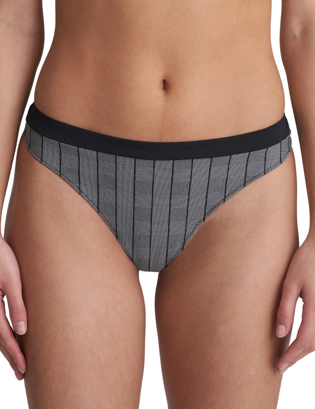 Cool and feminine, this brief from the Robert collection at Marie Jo will give you officewear vibes in your lingerie. The brilliant cut to this thong offers a high leg cut with a low rise waist, so it will sit nicely on your hips with an elongated look of your legs. The rear has the classic cheeky look with sleek finishes for a smooth wear. The front is finished with a trendy checked fabric and contrasting waistband.  Trendy and feminine design Checked fabric Minimal rear coverage Low rise waist High leg cut Composition: 73% Polyamide &pipe; 19% Elastane &pipe; 8% Cotton Listed in UK sizes  50719-91655-1206008 0622100  Thong