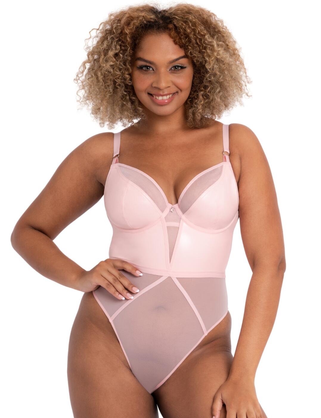 Make a sexy entrance in this jaw-dropping body from the Lucky Star lingerie line by Curvy Kate. The vegan leather with semi-sheer mesh panel inserts creates a sexy bondage-inspired look. The high-cut design elongates the legs combined with a plunging neckline to highlight all your curves. Underwiring offers added support to the non-padded cups and adjustable straps create a flawless fit. A star charm sits between the breasts adding a luxury detail.  Sexy bondage-inspired style Luxurious vegan leather Seductive semi-sheer panels Lucky Star charm Underwired for support Alluring plunging neckline Elongating high-leg cut Moderate rear coverage Hook and eye closure Adjustable shoulder straps Country of origin: China Composition: Main: 95% Polyester 5% Elastane Composition: Main 2: 100% Polyester Composition: Lining: 100% Polyamide Composition: Wing Mesh: 73% Polyamide 27% Elastane Composition: Mesh: 92% Polyamide 8% Elastane Composition: Gusset Liner: 100% Cotton Listed in UK sizes  53965-96649-1259885 CK031704 Plunge Body