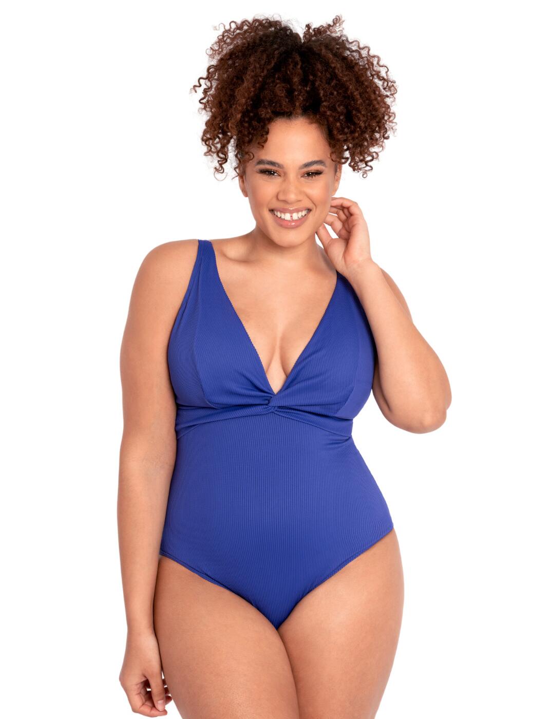 The classic look of this Twist & Shout swimsuit from Curvy Kate is ideal for a stylish outing to the beach. The deep plunging neckline with triangle cups, together with the cheeky cutout on the back, is sure to garner you some attention, while the opaque material and full rear coverage will preserve your modesty. The adjustable shoulder straps can be worn in three different ways - over the shoulders, in a criss-cross design or as a halterneck - and allow you to add a little of your personal style to the swimsuit. As a final fashionable touch, the swimsuit features a cheeky twist detailing in the centre, completing the classic swim look.  Deep plunging neckline with triangle cups Ribbed elastic material Adjustable multiway shoulder straps Swimwear clicker back closure Full rear coverage Lightly lined cups Non-wired Matching coordinates available Country of origin: China Listed in UK sizes  53981-96665-1259778 CS024606 Swimsuit
