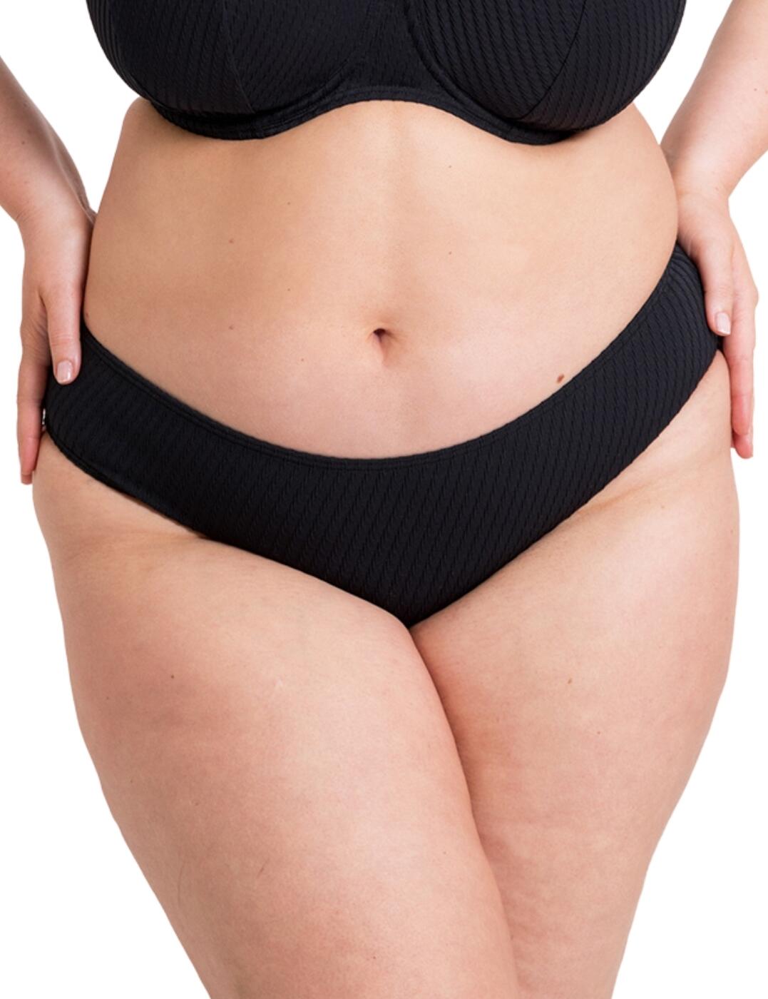 Dive into your holiday with confidence and style with the Curvy Kate Jet Set classic bikini brief. The brief features a mid-rise waist that sits comfortably on your curves, providing just the right amount of coverage. But what sets this bikini brief apart is its unique twisted ribbed texture that adds a touch of sophistication and modernity to your poolside look. Designed for women who embrace their bodies, the Jet Set bikini brief boasts a high leg rise that elongates your legs and accentuates your curves. And let's not forget about the rear coverage, the moderate coverage is just enough to show off your curves without revealing too much skin. Plus, there are now matching coordinates available to complete this chic ensemble.