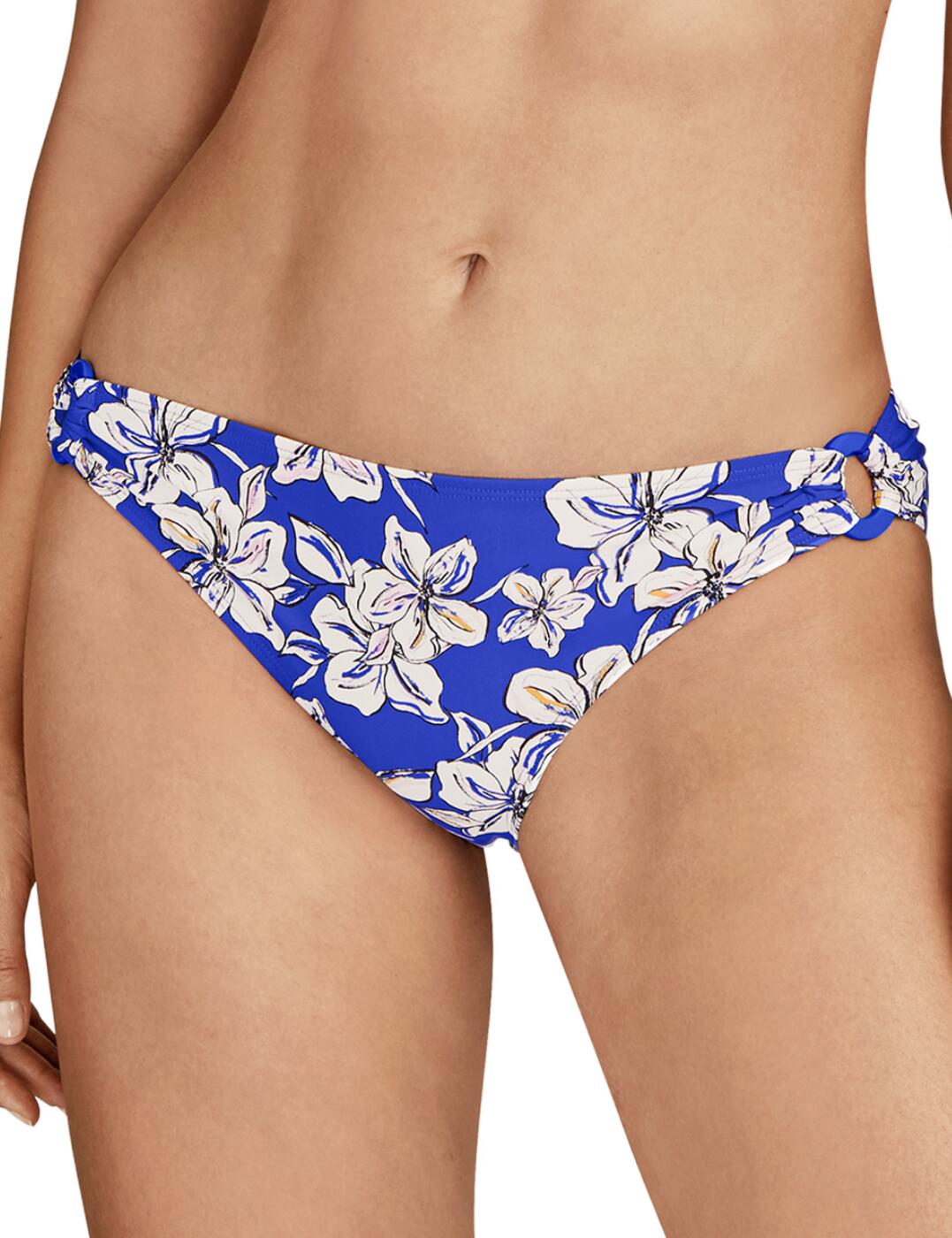 Serving hot and lavish style is the Parfums D'Ete range by Aubade. Snatch up this Brazillian brief to make your poolside cocktail and chillout session an experience you'll never forget. Featuring gorgeous, o-ring detailing on the hips to draw attention to those curves, this bikini brief truly has it all. Offers moderate rear coverage to maintain modesty whilst also giving a cheeky peek. Matching set available to complete this gorgeous look.  Fun, flirty and thriving O-ring detailing on hip Moderate rear coverage Gorgeous, floral print Sits beautifully on hips Matching co-ordinates available Country of Origin: China Composition:- Lining: 90% Polyester &pipe; 10% Elastane Composition:- Knit: 73% Recycled Polyamide &pipe; 27% Elastane Listed in UK sizes  54553-97333-1263369 TU22 Brazilian Bikini Brief