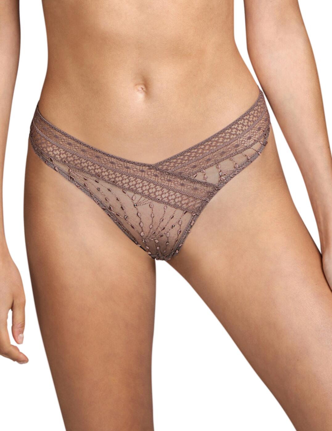 The Vaughan luxury thong by Andres Sarda offers a seductive blend of sheer fabrics and minimal coverage. This thong flaunts a low-rise waist that highlights your midsection and is finished with soft embroidery for a complimentary fit. The sheer fabric is adorned with delicate embroidery giving just a teasing glimpse of your curves. The minimal rear coverage frames your curves, crafted from soft tulle for a comfortable fit.  Low-rise waist Feminine embroidery Minimal rear coverage Country of origin: Tunisia Composition: 49% Polyamide &pipe; 28% Polyester &pipe; 16% Cotton &pipe; 7% Elastane  Listed in UK sizes  54681-97535-1264949 3310659  Luxury Thong