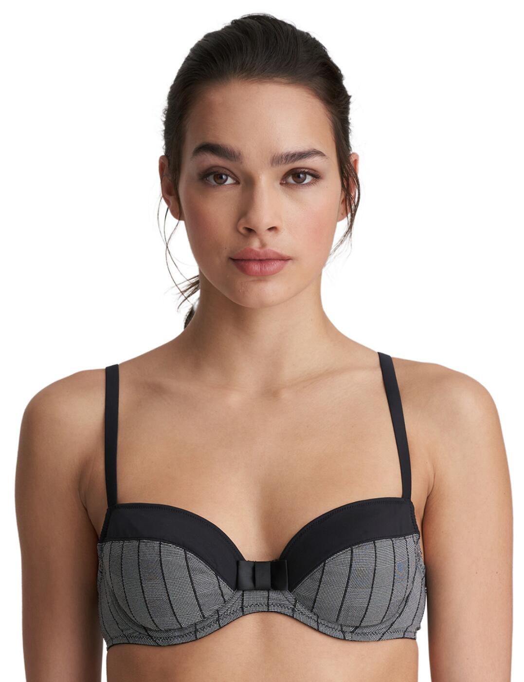 The checked design fabric to this bra gives a formal vibe, all part of the Robert range at Marie Jo. Sophisticated in style, this bra will be a great work day wear. The cups are underwired in a balcony shape, so will frame the bust nicely, and is finished with a large bow detail at the centre. The top cups contrast the bottom cups and offer a smooth finish under your clothing.  Modern and sleek design Underwired Balcony cups Checked print fabric Bow detail at centre Small hook and eye closure Adjustable straps Composition: 81% Polyamide &pipe; 19% Elastane Listed in UK sizes  50793-91735-1208401 0122100  Balcony Bra