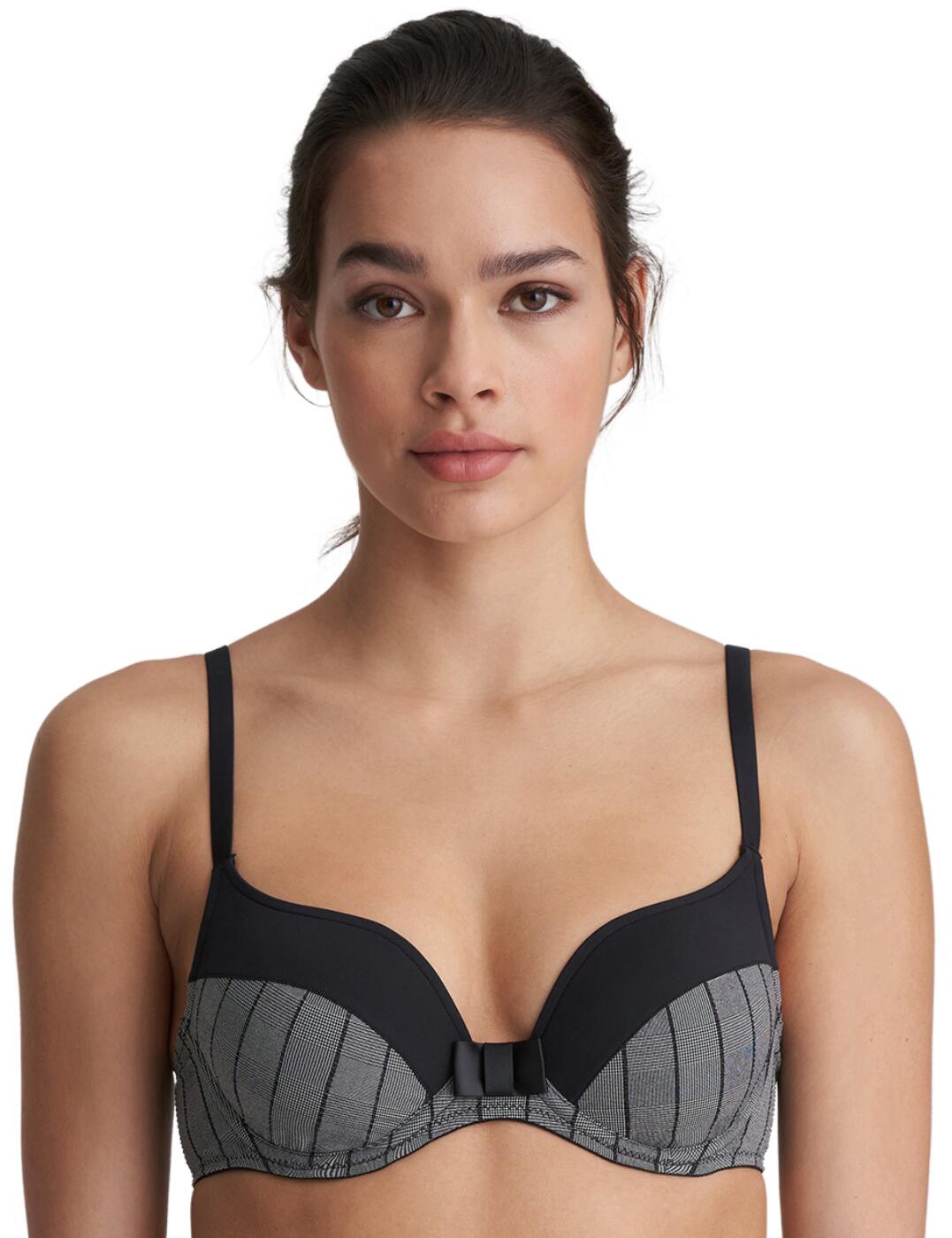 This sweet and sophisticated bra from the Robert collection at Marie Jo is a great base to your work outfits. Giving office-wear vibes, this bra is adorned with a sleek checked fabric and a stylized bow between the cups. The top cups are contrasting with a clean finish to give this a smooth appearance under your clothing. The cups are underwired and padded for a nice bust shape and finished with a sweetheart neckline which really rounds off the cleavage in a feminine shape.  Sophisticated and feminine design Checked pattern Contrasting top cups with smooth finish Underwired Padded cups Sweetheart neckline Small hook and eye closure Adjustable straps Composition: 45% Polyamide &pipe; 42% Polyester &pipe; 13% Elastane Listed in UK sizes  50817-91778-1208147 0122106  Padded Bra