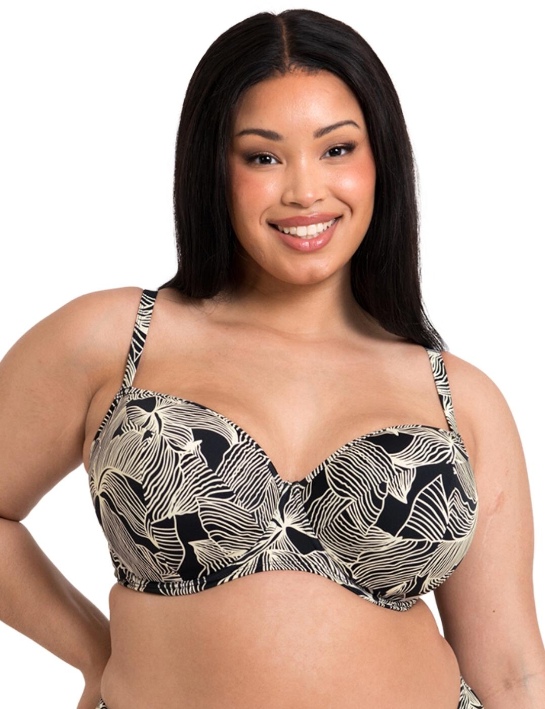 Make a statement on your next getaway with the Curvy Kate Ripple Reef balcony bikini top. Featuring a beautiful and eye-catching leaf print, this balcony bikini top will have heads turning everywhere you go. But it's not just about the looks with this top it also offers full coverage and ample support with its underwired design. That's not all, the padded cups provide an extra lift and shape to give you that perfect silhouette on the beach. Adjustable shoulder straps allow for a customized fit while the classic back closure ensures a secure and comfortable feel all day long. Finally, this balcony bikini top also has matching coordinates available, so you can create a complete and coordinated beach or pool look.