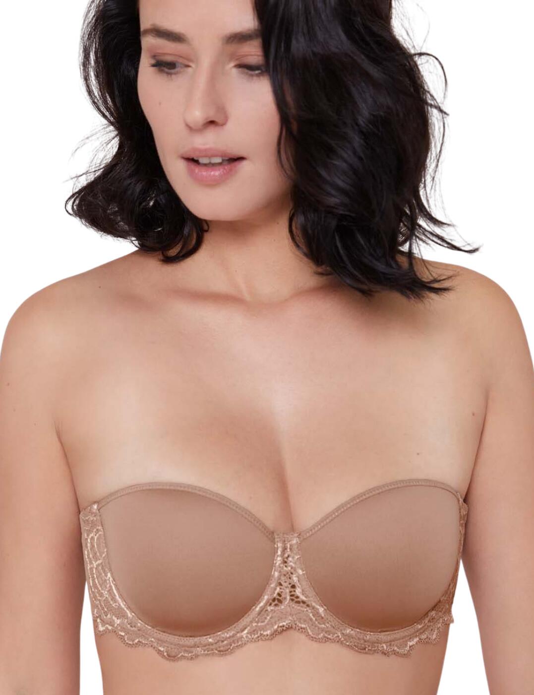 This strapless bra from the Caresse collection at Simone Perele is incredibly designed to not only give a smooth finish under your clothing but also will sit firmly in place, support you perfectly and feel lightweight. What more could you want from a strapless bra? The cups are spacer fabric which give a curve-hugging moulded fit that is light and breathable, as well as classic underwire for that nice uplift. This bra is adorned with soft lace accents at the underwire for a feminine feel, whilst it also lays flat so will keep an invisible appearance under your clothing. This bra comes with detachable, convertible straps, giving this bra great versatility; so it can be worn in five ways: strapless, halterneck, one-shoulder, regular shoulder or racerback.  Supportive and practical design Moulded Spacer cups Underwired Soft lace accents that lay flat for invisibility under clothes Detachable, adjustable straps Straps can be worn as halterneck, regular shoulder or racerback or as strapless Hook and eye closure Composition: 53% Polyester &pipe; 30% Polyamide &pipe; 17% Elastane Listed in UK sizes  51025-92147-1225271 12A300.768 Strapless Bra