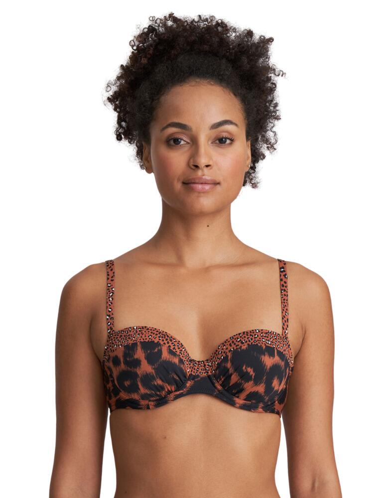 Look and feel amazing in this gorgeous Amanda preshaped bikini top from Marie Jo. Featuring padded cups for a naturally rounded shape. Multiway straps can be adjusted whether over the shoulder or around the neck for a unique and comfortable fit. The balcony styling creates a lower cut enhancing your gorgeous cleavage. Ruching at the bottom of the cups adds a playful touch. Underwiring and the clasp closure ensure all-day support. Pair with matching items to complete the look.  Padded Multiway adjustable straps Balcony styling Ruching at the bottom of the cups Underwired Clasp closure Composition: 48% Polyamide &pipe; 43% Polyester &pipe; 9% Elastane Listed in UK sizes  50956-92030-1210334 1003919 Balcony Bikini Top