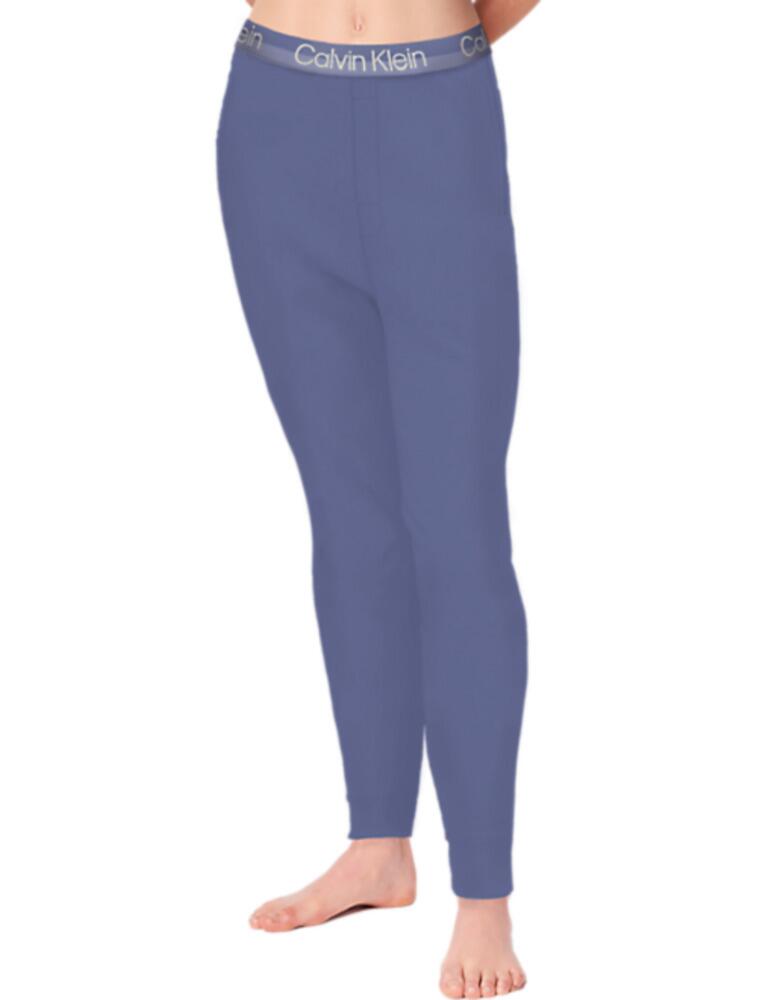 The Structure Lounge joggers from Calvin Klein offer a more modern look to the classic joggers. A thick and elasticated waistband and faux fly gives a clean look without the need for drawstrings and buttons. The tapered fit of these joggers make them perfect for the gym as well as lounging in at home. Elasticated cuffs keep your feet free and the warmth in. A high cotton count offers you more comfort and breathability. Branding is featured across the waistband as well as being embroidered in a matching colour to the pant on the ankle. The side pockets allow you to keep your essentials close.  Elasticated waistband Embroidered logo Tapered fit Elasticated ankles Side pockets Composition: 58% Cotton &pipe; 39% Recycled Polyester &pipe; 3% Elastane Listed in UK sizes  51290-92582-1222535 000QS6757E Jogger