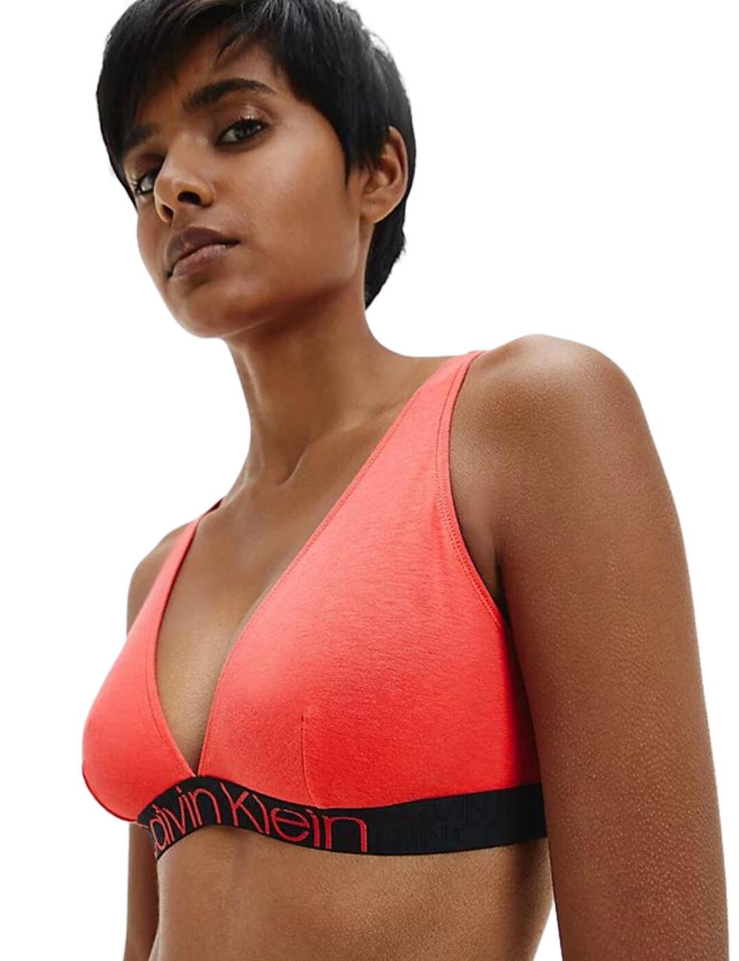 Look amazing in this triangle bralette by Calvin Klein CK Reconsidered range which creates sustainable lingerie with a biodegradable blend of recycled cotton and wood fibre. It has soft triangle cups that are unpadded and non-wired. The bralette features adjustable shoulder straps that can be worn as a cross-back style. It has the iconic Calvin Klein waistband which has a small hook and eye closure on it to the rear.  Triangle bralette Sustainable lingerie Made from a biodegradable blend of recycled cotton and wood fibre Soft unpadded triangle cups Non-wired Adjustable shoulder straps Option of cross-back straps Iconic Calvin Klein waistband Small hook and eye closure Composition: 50% Cotton &pipe; 30% Lyocell &pipe; 16% Modal &pipe; 4% Elastane Listed in UK sizes  51096-92288-1218205 000QF6577E Triangle Bralette