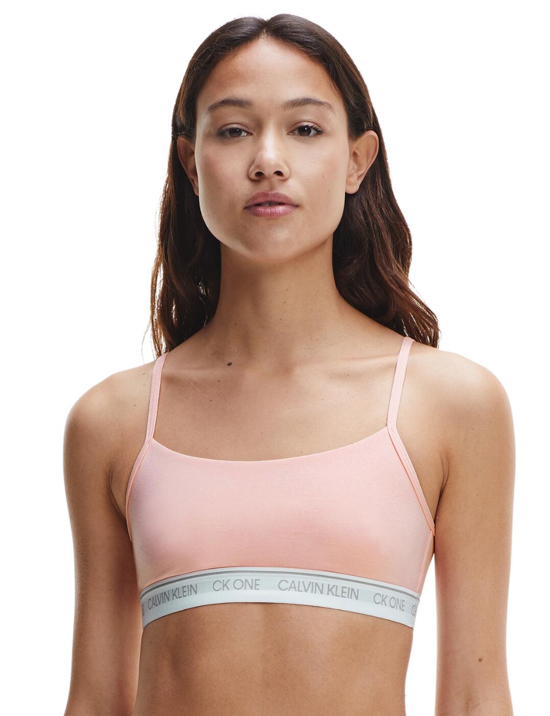 The CK One Cotton collection by Calvin Klein offers a timeless sports-luxe style in comfortable lingerie and sleepwear designs. This unlined string bralette has an easy pull-on design with a classic rounded neckline for a minimal sporty look. The iconic Calvin Klein underband adds a designer finish to this classic athlesiure style. A non-padded and unlined design allows for comfortable all-day and all-night wear. For a casual-cool coordinated look, wear with matching lingerie from the CK One Cotton range by Calvin Klein.  Signature logo underband Sports-luxe style Rounded neckline Adjuatable string straps Easy pull-on design Unlined and non-padded Composition: 55% Cotton &pipe; 37% Modal &pipe; 8% Elastane Listed in UK sizes  51122-92315-1240195 000QF5727E Unlined String Bralette