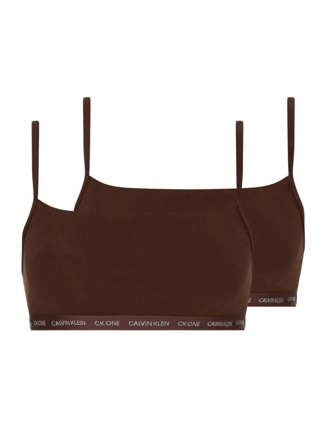The iconic CK One Cotton lingerie series by Calvin Klein offers premium everyday lingerie in a timeless athleisure style. This pack of 2 bralettes are unlined and non-wired for a comfortable all-day fit. This classic pull-on design with signature logo underband add a designer finish to the minimal string design. Complete the sports-luxe look with coordinating lingerie available from the CK One Cotton collection by Calvin Klein.  Signature logo underband 2-pack bralettes Sporty square neckline Pull-on design Adjustable string style straps Unlined and non-padded Non-wired Composition: 55% Cotton &pipe; 37% Modal &pipe; 8% Elastane Listed in UK sizes  51135-92386-1240417 000QF6040E  2 Pack Bralettes