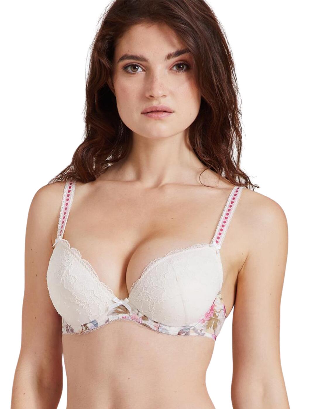 Spoil yourself with the gorgeous Magic Garden collection from Aubade. This bra features a deep plunging neckline, which allows you to wear it even under more revealing outfits with the lingerie remaining invisible under clothing. The flattering décolletage is shaped and supported by the underwired moulded cups, creating an alluring look. The under-band is decorated with a stunning floral print, which is offset by the delicate Leavers lace on the cups. The adjustable shoulder straps are decorated with an interesting ladder pattern, and the cute satin bows adorning the straps and bridge complete the elegant and feminine look.  Deep plunging neckline Floral print on the band Leavers lace on the cups 2-part half coverage cups Satin bow details Adjustable shoulder straps Hook and eye back closure Moulded cups Underwired Matching coordinates available Country of origin: Tunisia Composition: Cup lace: 74% Polyamide &pipe; 26% Elastane Composition: Lining: 100% Polyester Composition: Bottom lining: 100% Cotton Composition: Tulle: 84% Polyester &pipe; 16% Elastane Listed in UK sizes  54936-97974-1273741 IAN18 Plunge Bra