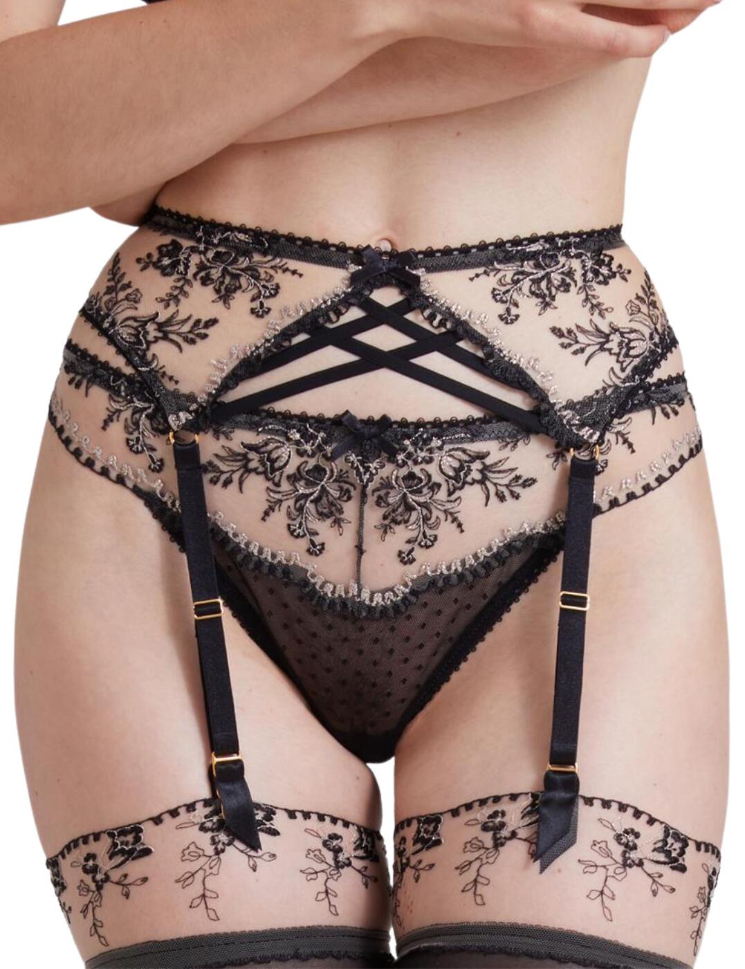 Every classy lady deserves some pampering, and this Tresor Infini suspender belt from Aubade is just what you need to complement your sensual and luxurious lingerie. The stunning embroidery decorated with metallic thread and chic strappy detailing, iconic to the Tresor Infini collection, adorn the front of this piece, creating a truly refined outlook. The back is decorated with a semi-sheer material with a dotted pattern, boasting a hook and eye closure for a comfortable fit. Clip the four adjustable garter straps to your favourite stockings for a full elegant and seductive look.  Sheer material with stunning embroidery on the front Dotted pattern on the back Strapping detail on the centre front 4 adjustable garter straps Hook and eye back closure Matching coordinates available Country of origin: Tunisia Composition: Front embroidery: 73% Polyester &pipe; 24% Polyamide &pipe; 3% metallic thread Composition: Tulle: 78% Polyamide &pipe; 22% Elastane Listed in Uk sizes  54961-97999-1271331 ID50 Suspender Belt