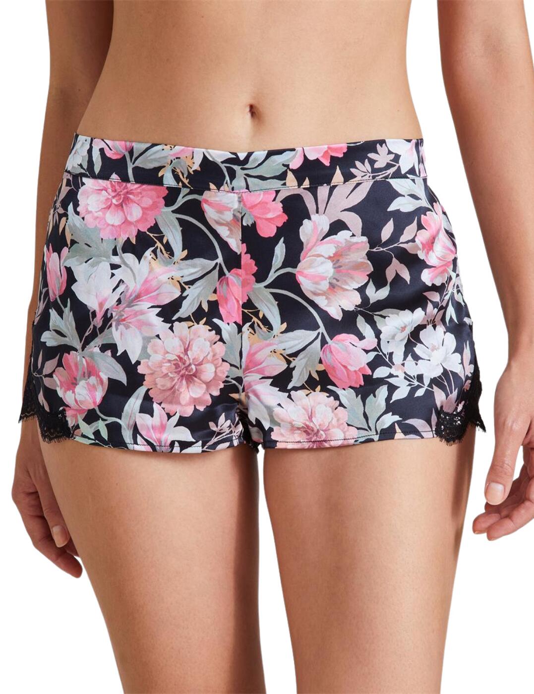 The Toi Mon Amour collection from Aubade presents the most luxurious nightwear designs. These shorts are perfect for a stylish night in and will keep you feeling cool during hotter evenings. With the short length and elasticated waistband, this piece makes sure those lazy days and peaceful nights are spent in comfort. The dazzling floral print gives off a feminine but elegant vibe, while the unobtrusive delicate lace panels on the sides bring a bit of sensual touch to this beautiful design.  Eye-catching floral print Elasticated waistband Delicate lace panels on the sides Short length Matching coordinates available Country of origin: China Composition: Fabric: 100% Silk Composition: Lace: 100% Polyamide Composition: Gusset: 100% Cotton Listed in UK sizes  55087-98203-1272518 QS61-1 Short Brief