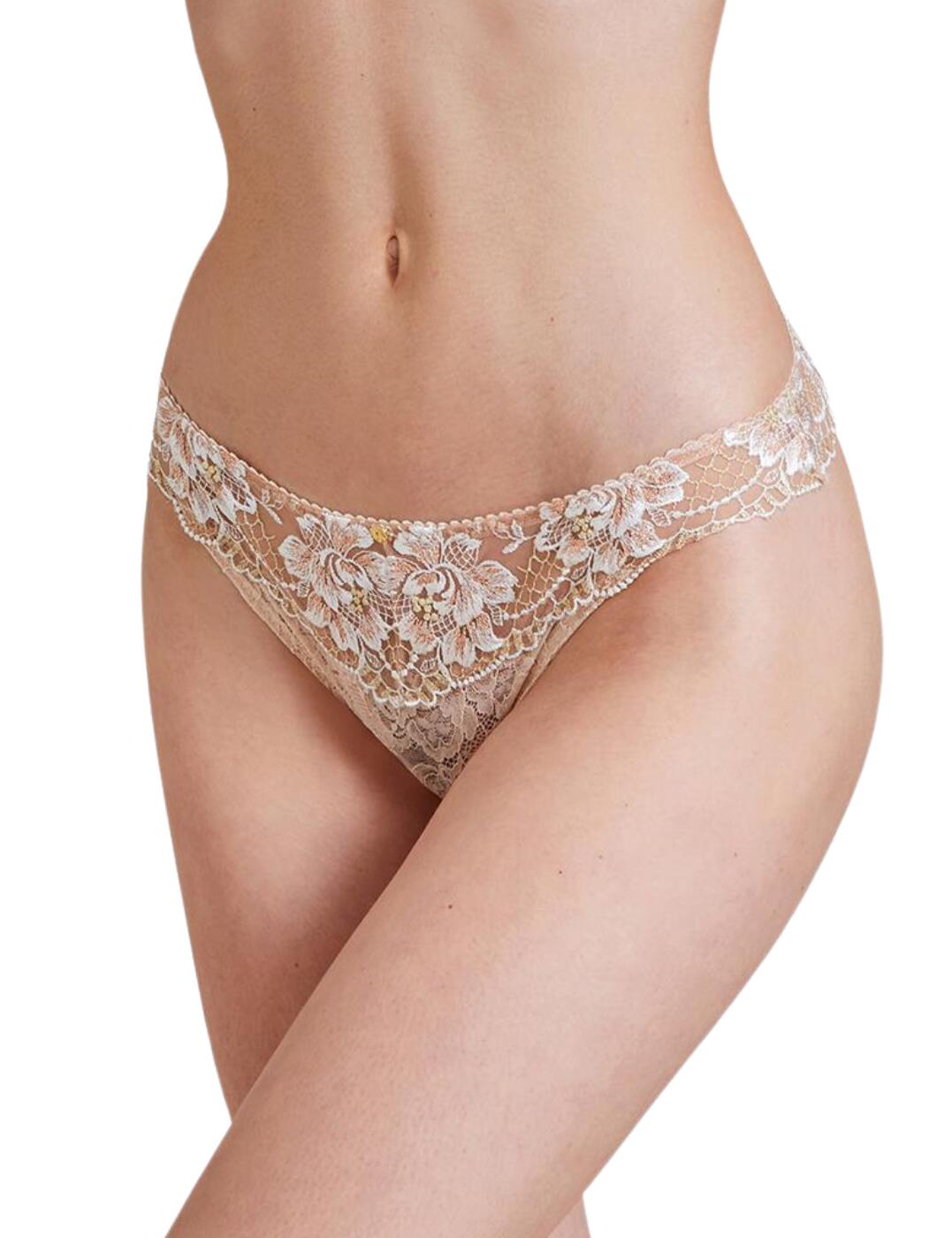 Aubade is renowned for its opulent designs in the most luxurious patterns and this Melodie D'ete collection is no different. These briefs in a seductive tanga style boast gorgeous floral embroidery surrounded by luxurious lurex thread and delicate feminine lace. The minimal rear coverage adds a bit of a cheeky style, while the elasticated mid-rise waist provides a traditional comfortable fit.  Seductive tanga style Captivating floral embroidery Minimal rear coverage Mid-rise waist Matching coordinates available Country of origin: Tunisia Composition: Embroidery: 59% Polyester &pipe; 30% Polyamide &pipe; 11% Elastane Composition: Lace: 84% Polyamide &pipe; 16% Elastane Composition: Seat: 100% Cotton  Listed in UK sizes  55092-98209-1272525 IC26 Tanga Brief