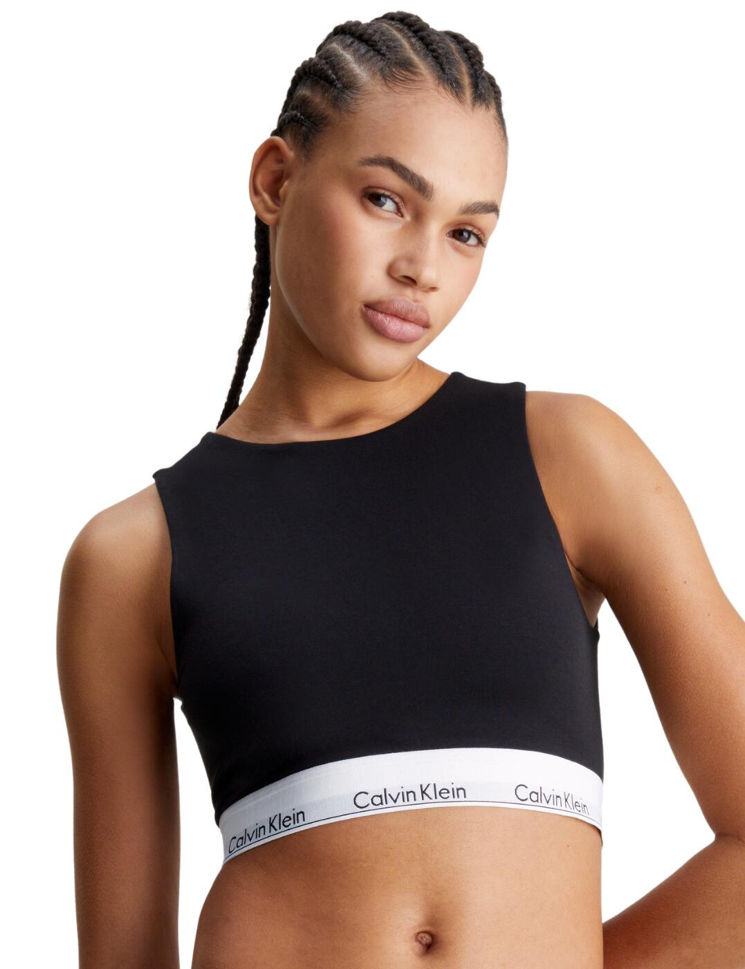 Meet the essential Calvin Klein Modern Cotton unlined bralette - the epitome of effortless style and unparalleled comfort. This non-padded, wireless design offers a natural shape with a fashionable high neckline for added coverage, perfect for any occasion. The allure of the sexy open back cannot be understated, ensuring you stand out. Its easy pull-on design, coupled with non-adjustable straps, guarantees a hassle-free experience, making it a practical yet chic choice. The soft, opaque fabric feels like a second skin, adorned with the iconic Calvin Klein underband for a touch of sophistication. Simplify your lingerie collection without compromising on style or comfort with this must-have bralette.