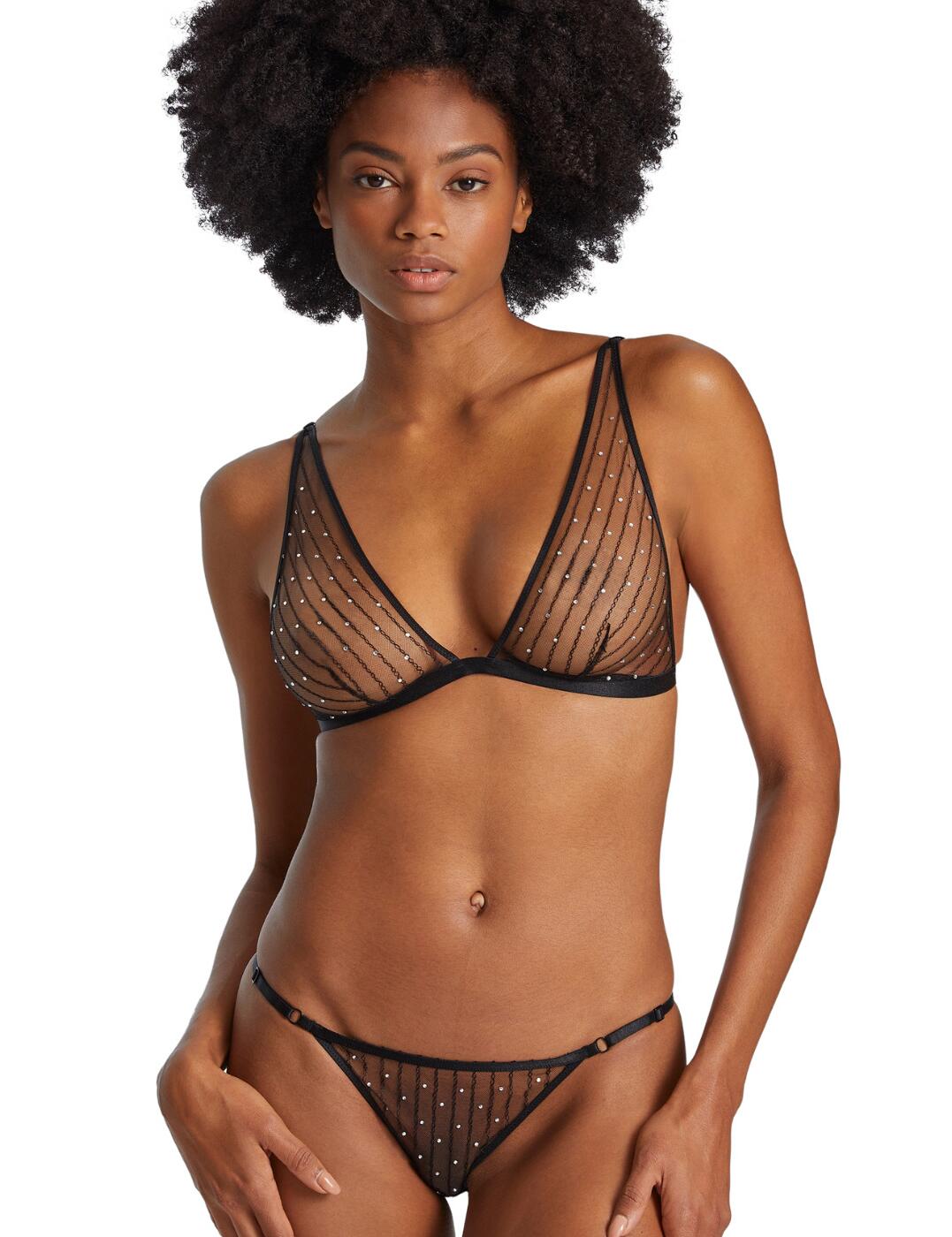 Aubade blends sophistication with luxury this season with the gorgeous Nuit Etoilee collection. This triangle bralette and mini mini-cœur brief set are crafted from beautiful embellished fabric that is adorned with dazzling diamante creating a truly iconic look. This bralette boasts a wire-free design for a look that perfectly showcases your naturally gorgeous curves. The brief is cut to a figure-hugging low-rise waist with moderate rear coverage for a soft, comfortable fit. This set features fully adjustable straps on both the brief and bralette for a fit you can tailor to your own figure.  One Size Triangle bralette and mini-cœur brief set Embroidered with glistening diamante Adjustable straps on bralette and brief Brief has a low-rise waist and moderate rear coverage Wire-free Non-padded Country of origin: Tunisia Composition: Embroidery: 100% Polyester Composition: Seat: 100% Cotton Listed in UK sizes  56747-100524-1303398 RX80 Wireless Bralette And Mini Brief Set